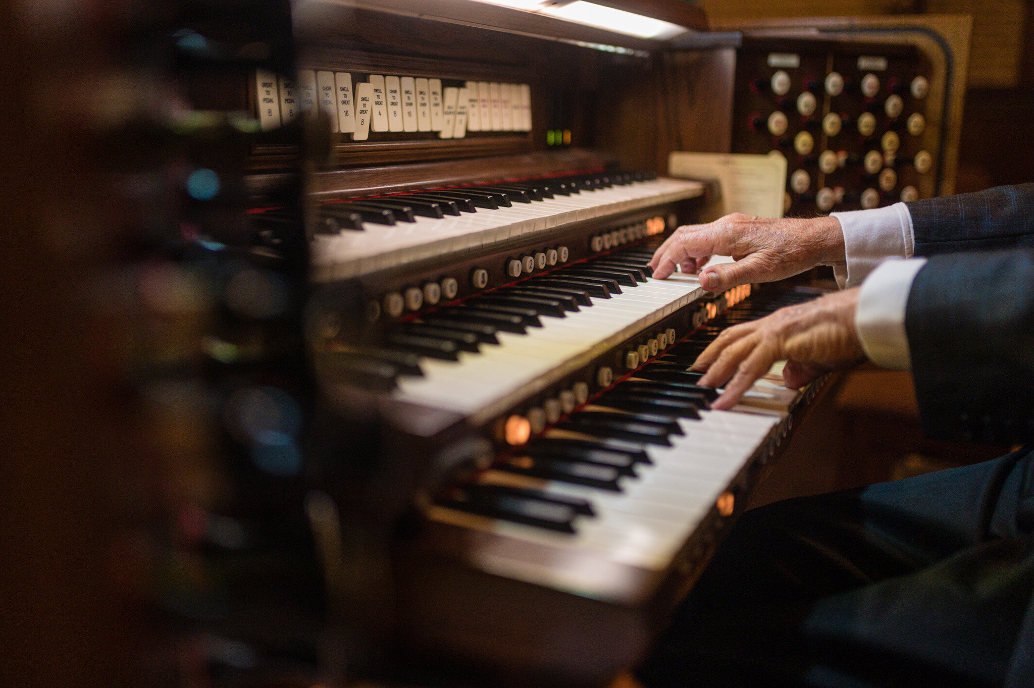 An organist provides music for a COVID elopement ceremony