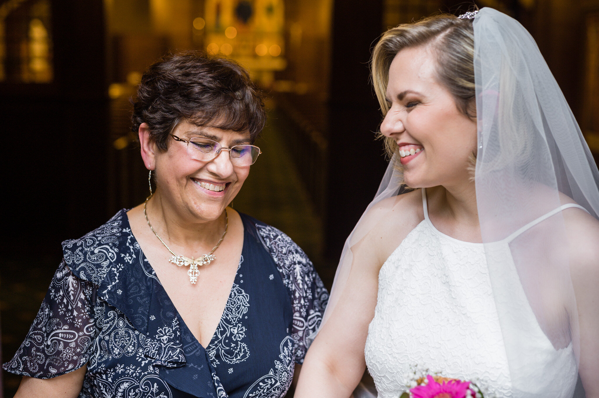 Mother and daughter sharing a moment together on her wedding day