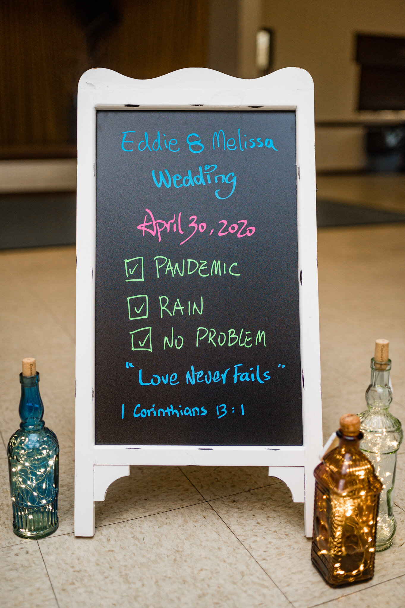 Wedding reception sign tells about the challenges of COVID and rain