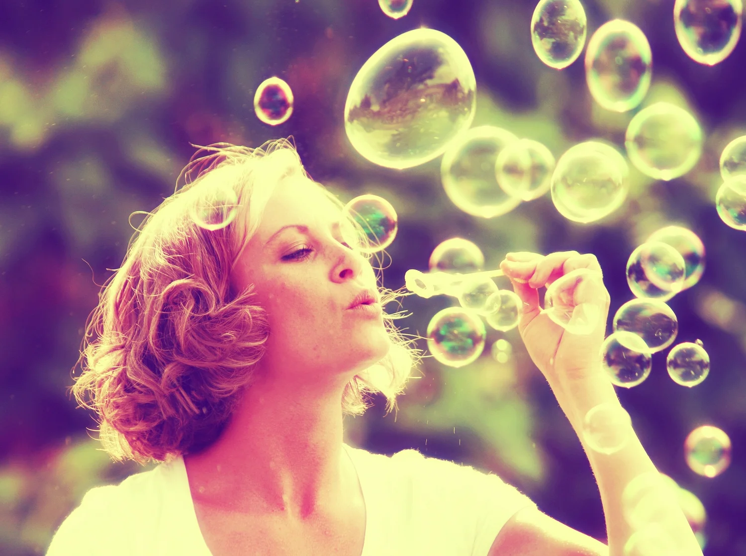 bigstock-a-pretty-girl-blowing-bubbles--62190965.jpg
