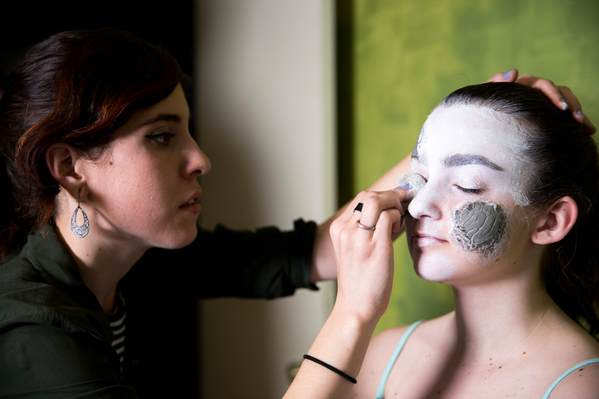 Mariam applying more of the white base. 