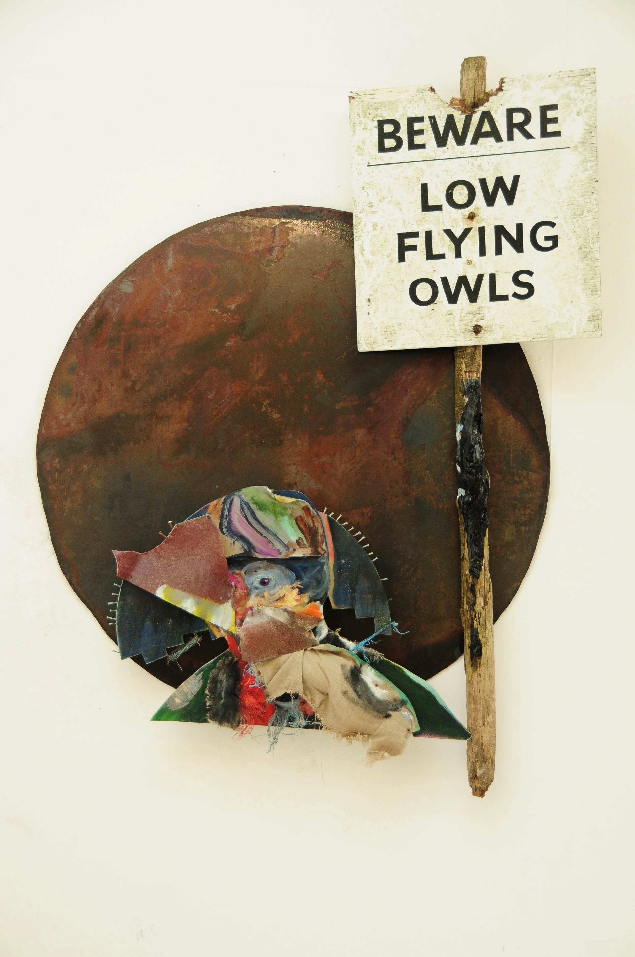 Low Flying Owls (2009), a mixed-media work by British artist Jonathan Joubert combining painting, steel, found material and plywood.