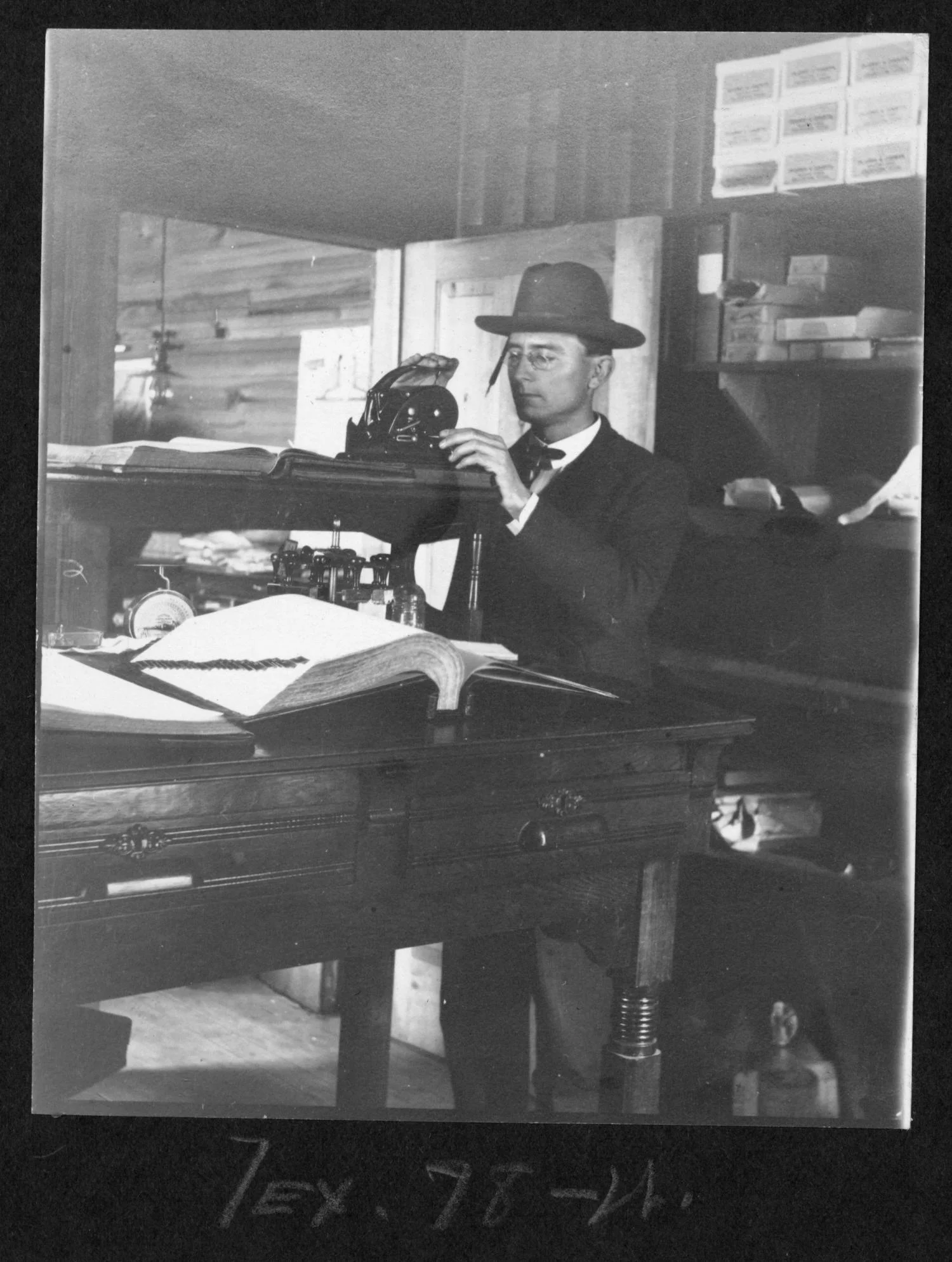 Tex78 Office Worker at Stand up Desk with Record Books