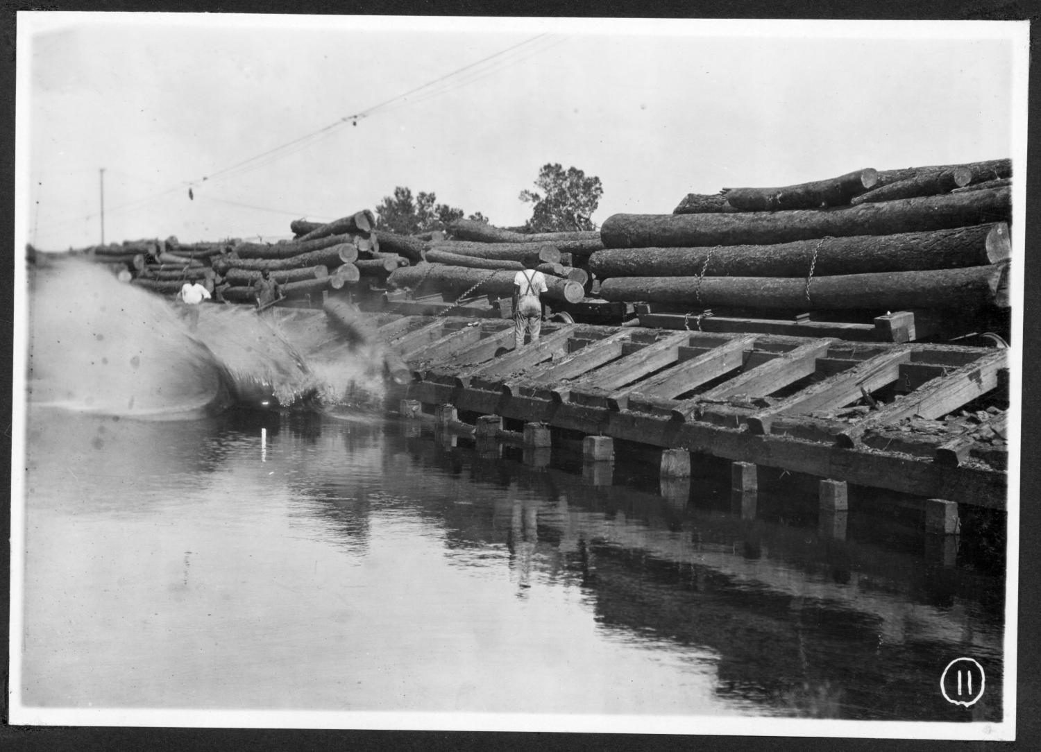 S. P. 308 Backside Unloading Logs into the Mill Pond