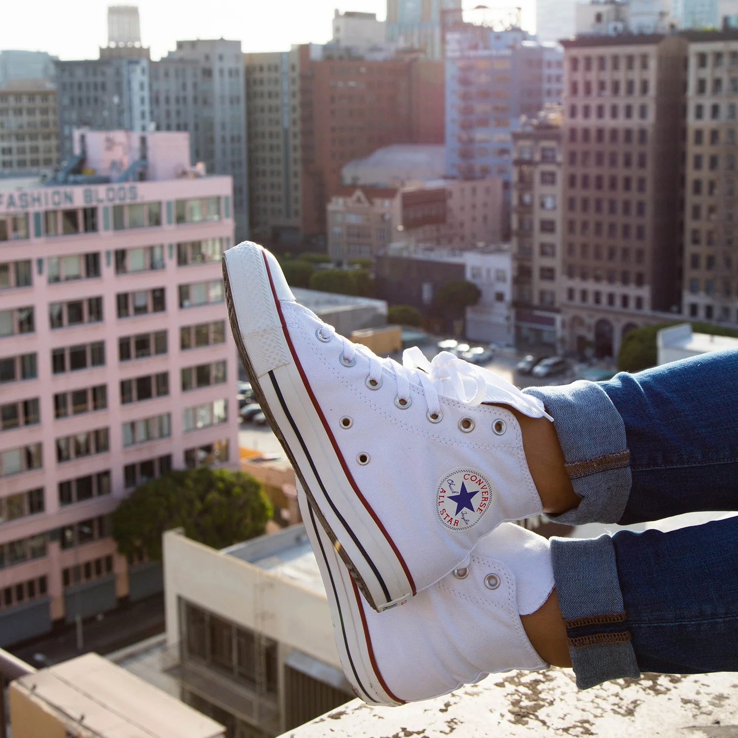 Lizette takes in the view of LA in her Optical White Chucks from her rooftop.