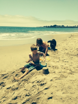 The beach is Seabright in Santa Cruz. There were riptides keeping the kids out of the water, so they played in the sand instead.