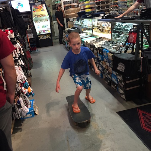 And he skateboards through the Santa Cruz store. 