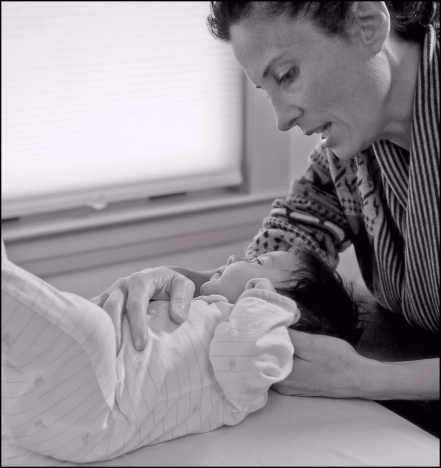 Kathleen performing osteopathy on a newborn in her Santa Rosa Office.