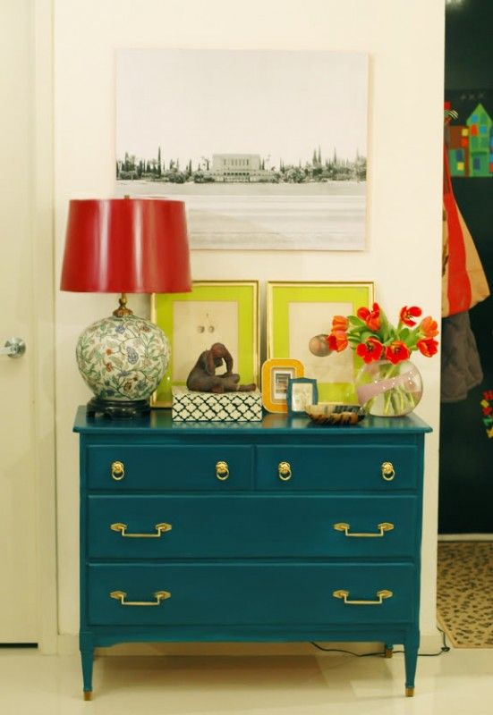 via Little Green Notebook Even though you have a red, a deep blue and a citrusy-yellow, the shades of these colors keep it from looking like a Crayola box and the brass pulls add sophistication.