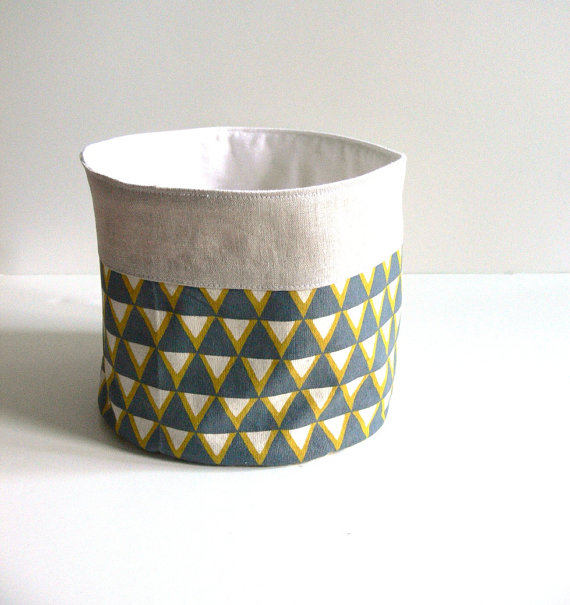 via Jenny Bartoy on Etsy This handmade basket would look good next to the painted dresser. Because it's taller than it is wide, you can't see into it as well, which would be good if your table doesn't allow you to put a basket underneath.