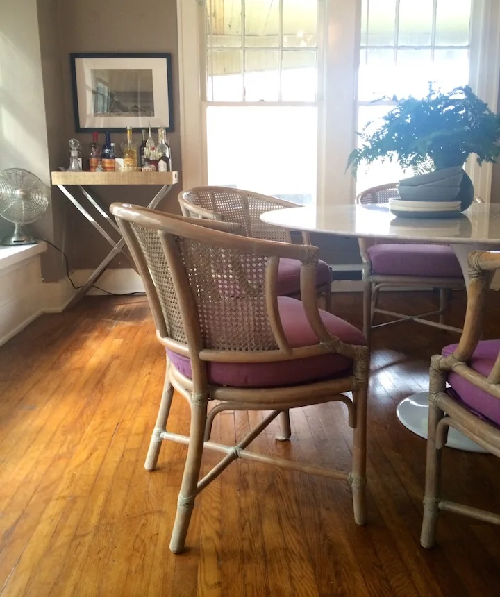 Ellen found these gorgeous 1960's rattan chairs on 1st Dibs. Their pairing with her Saarinen-inspired round marble table has us swooning. 