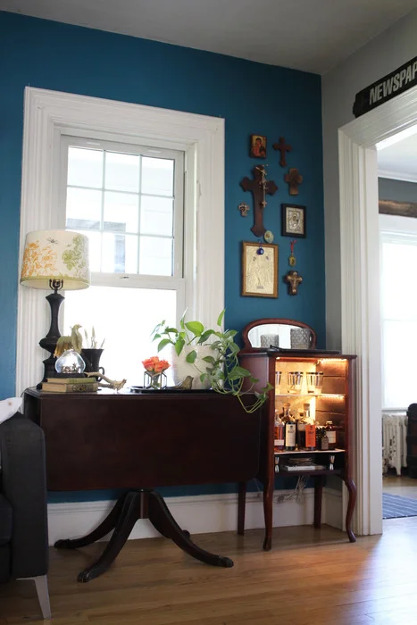 In the photo below, you'll see where Karen's collection of Greek crosses used to be in the dining room. Now that they're above the bar in the living room, she's enjoying them as if they were new to her. 
