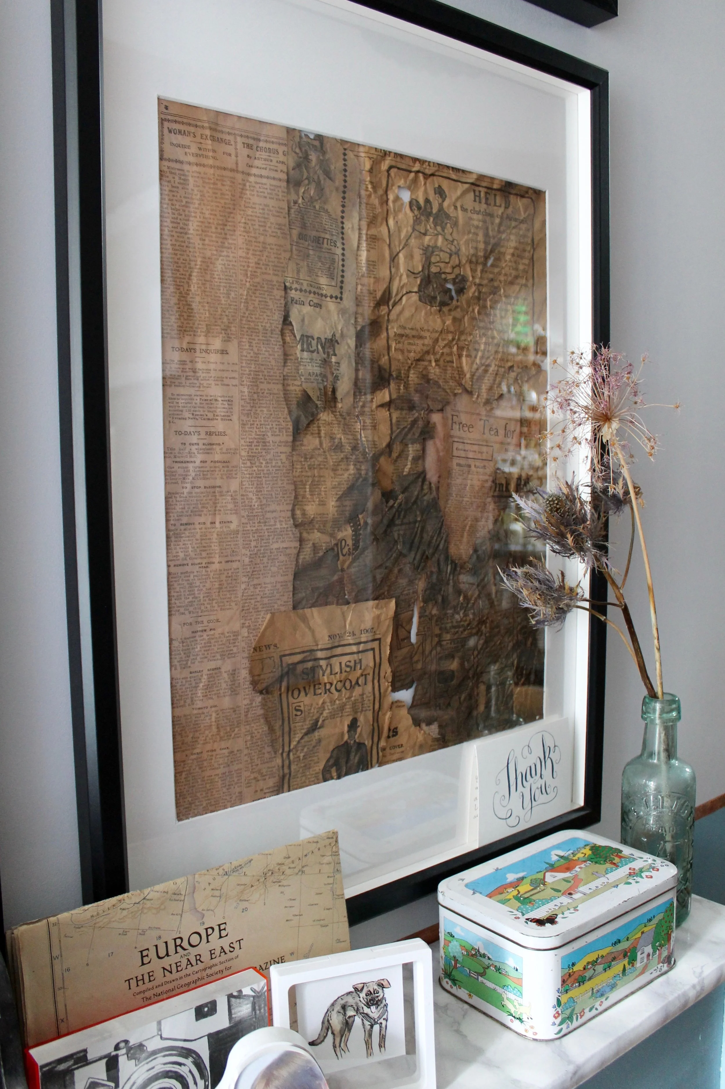 Photography provided by Joanna Thornhill - Framed newspaper scraps also found under the floorboards during renovations.