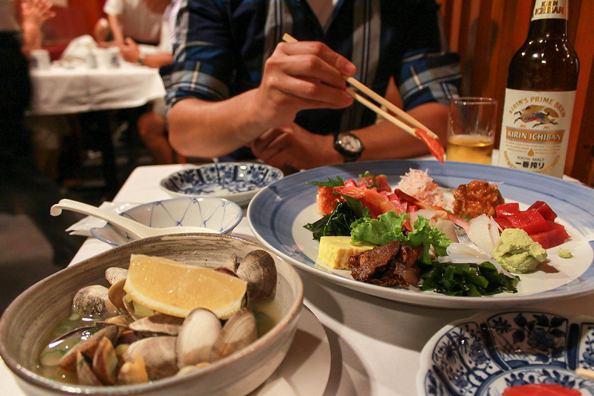 Steamed Clams and Sashimi Deluxe. He makes my heart flutter when he waits for me to set up the pic before he eats.