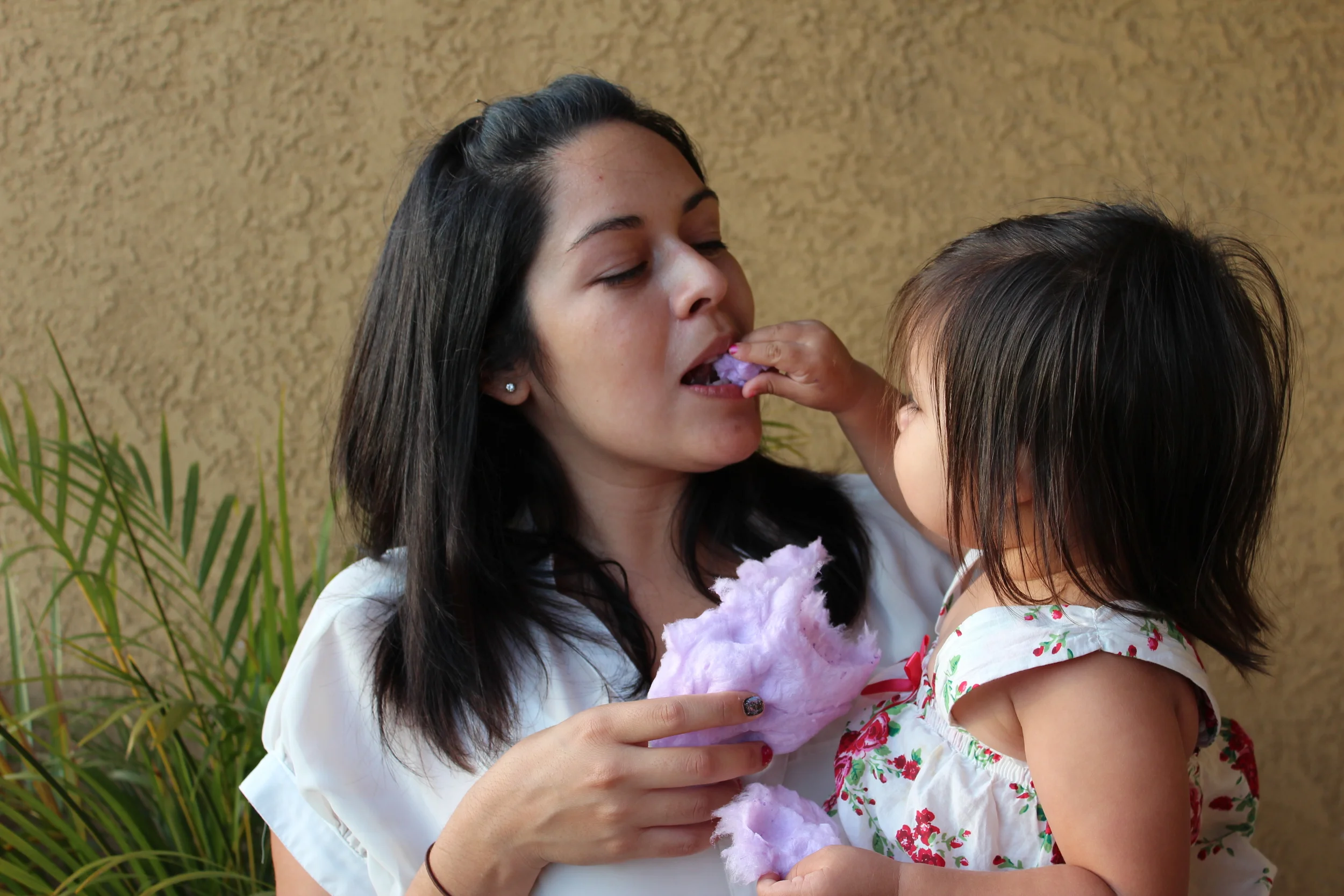 My baby daughter feeding me cotton candy in 2012.