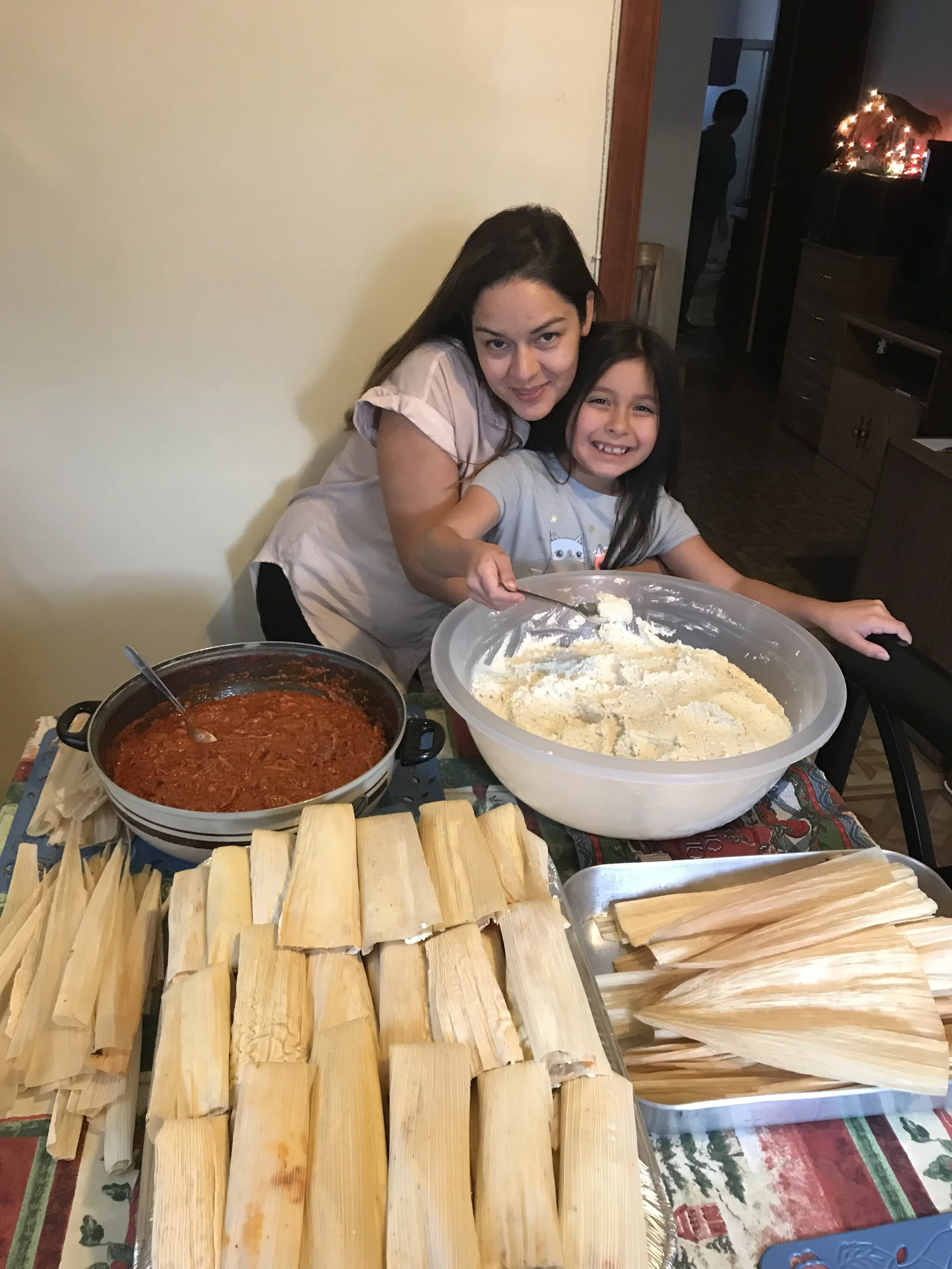 My daughter and I amid the corn husks.