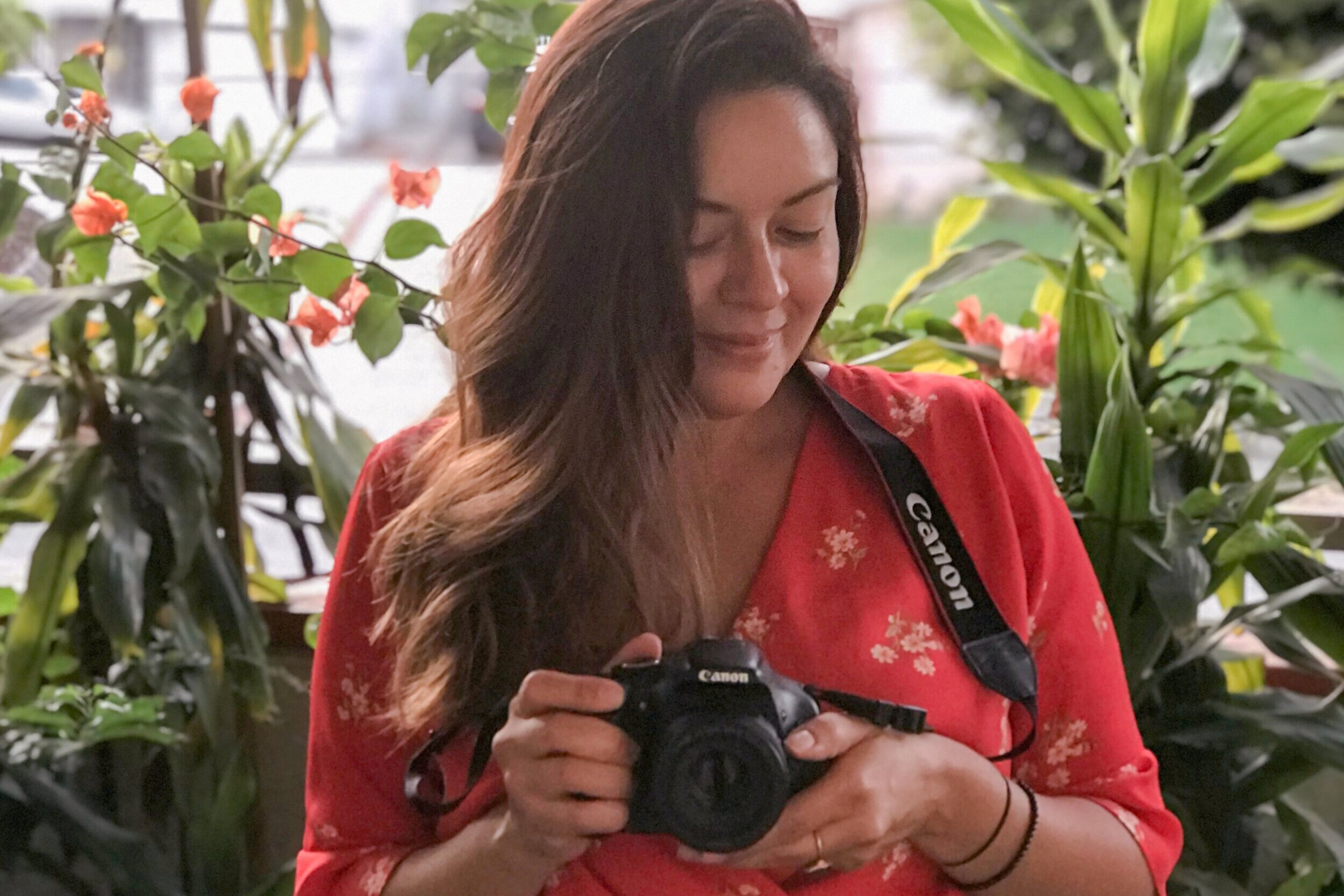 april+holding+camera+orange+top.jpg
