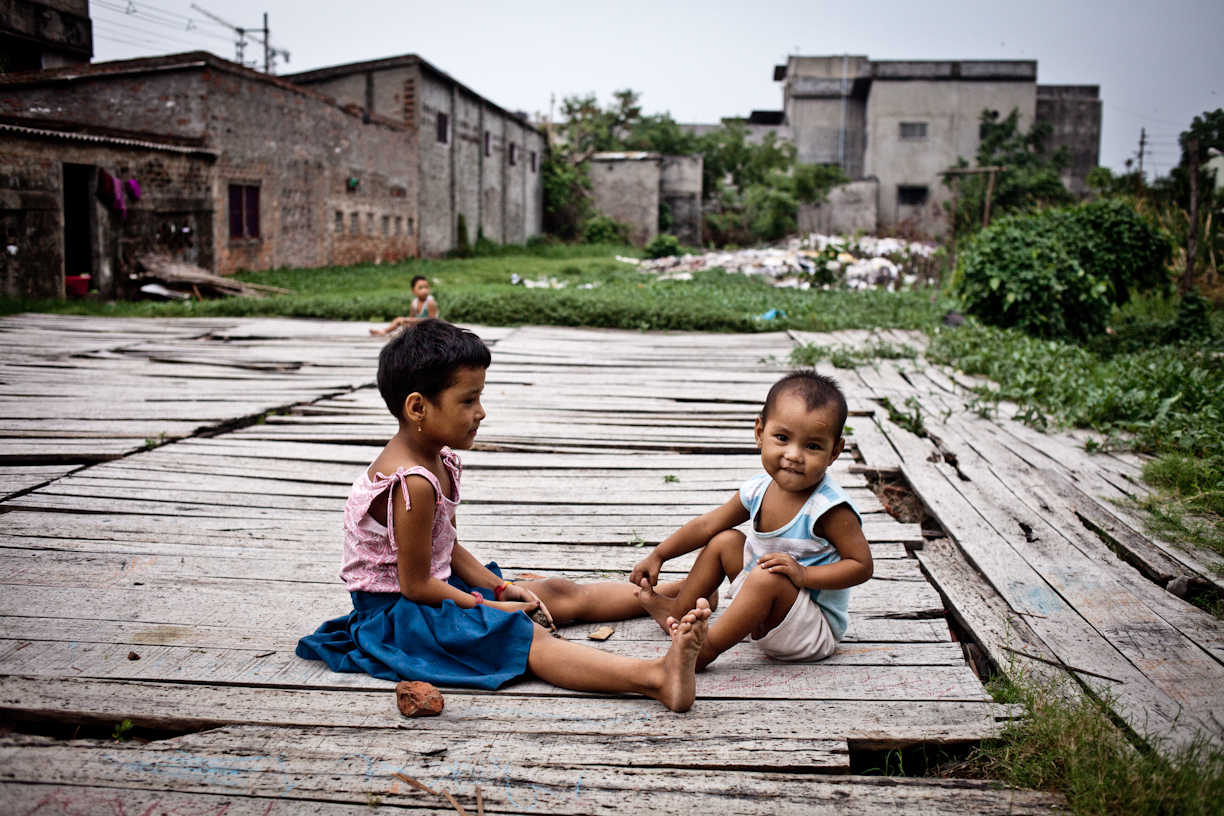 Children play in the ruins of one of China Towns old tanneries 