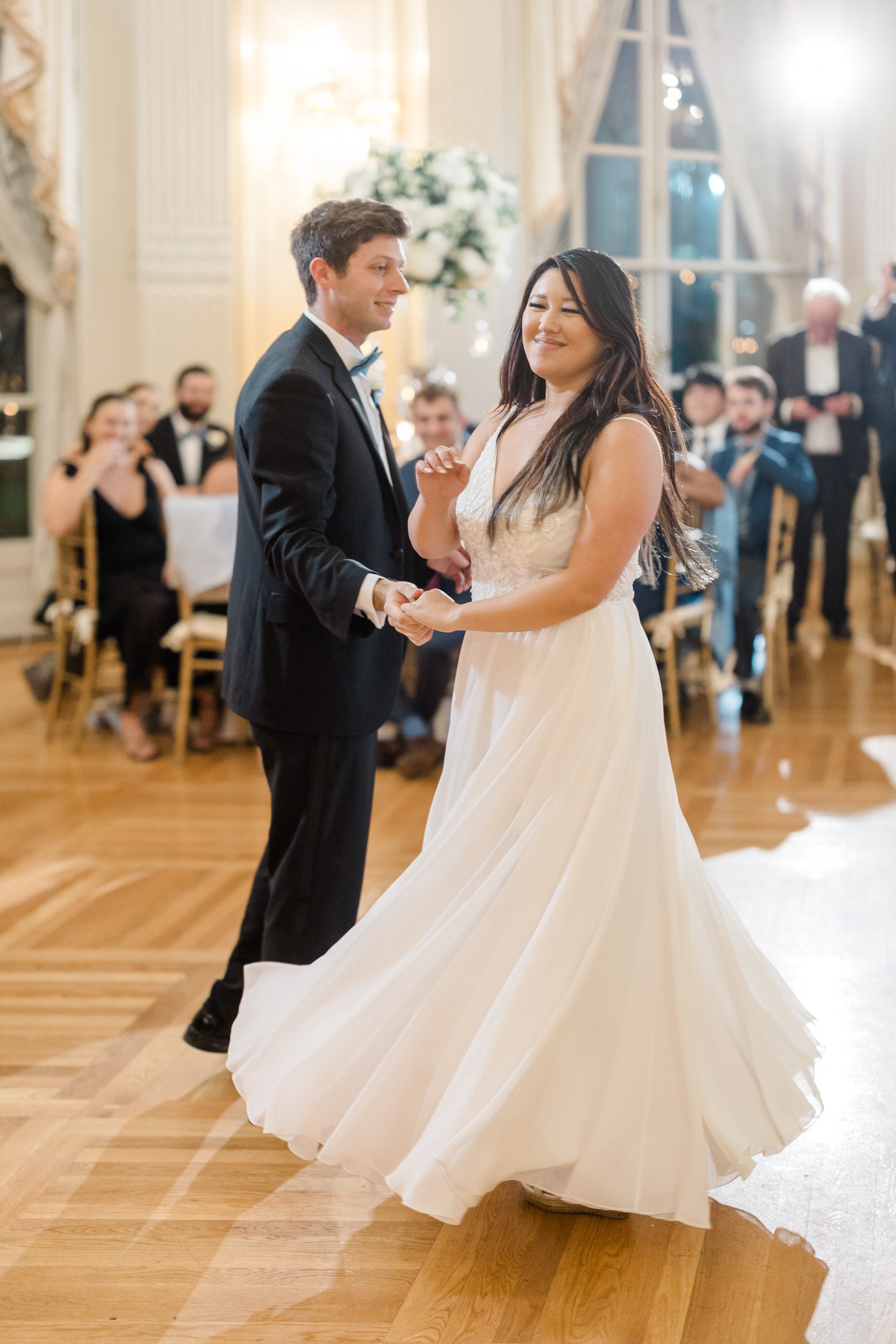 Bride and groom share their first dance as husband and wife at their Rosecliff Mansion Wedding