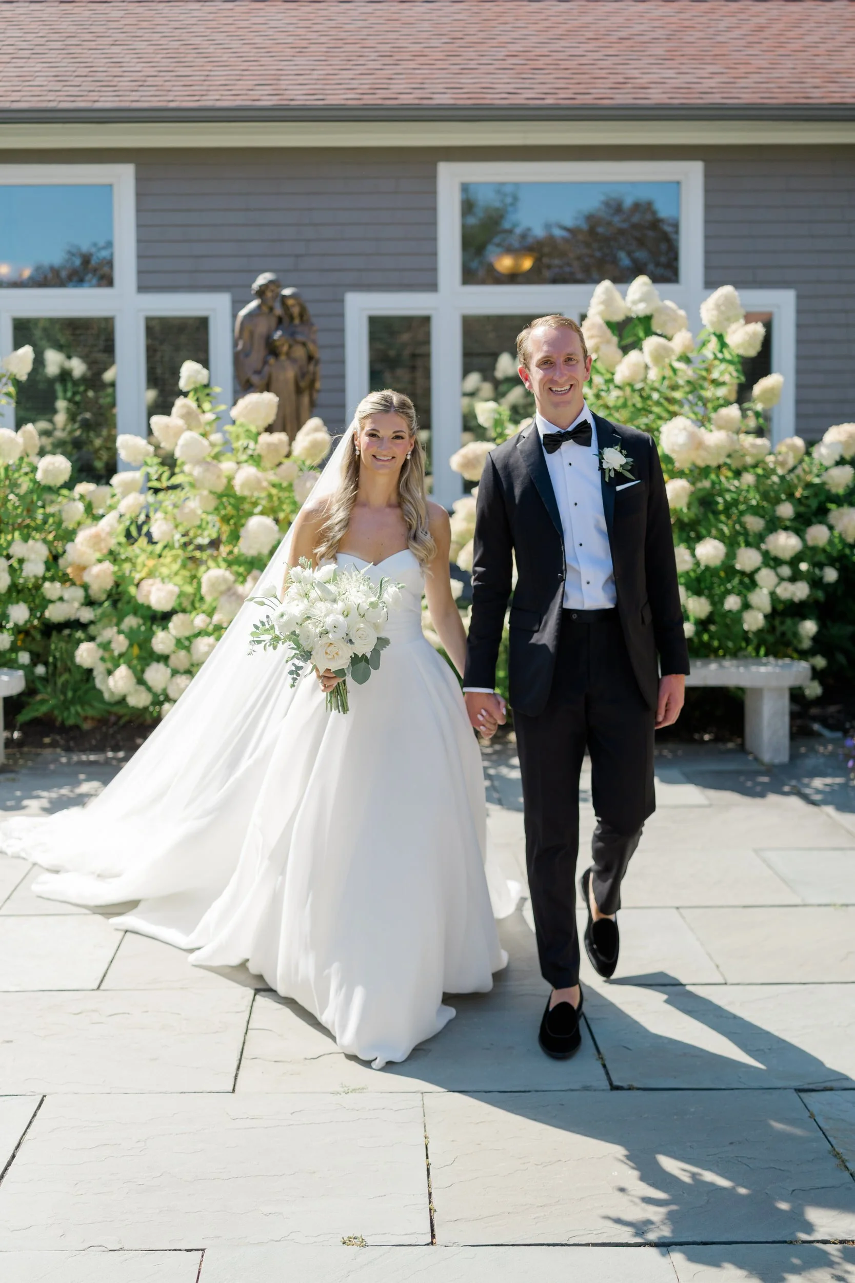 Couple's portraits at St Thomas More Church Wedding