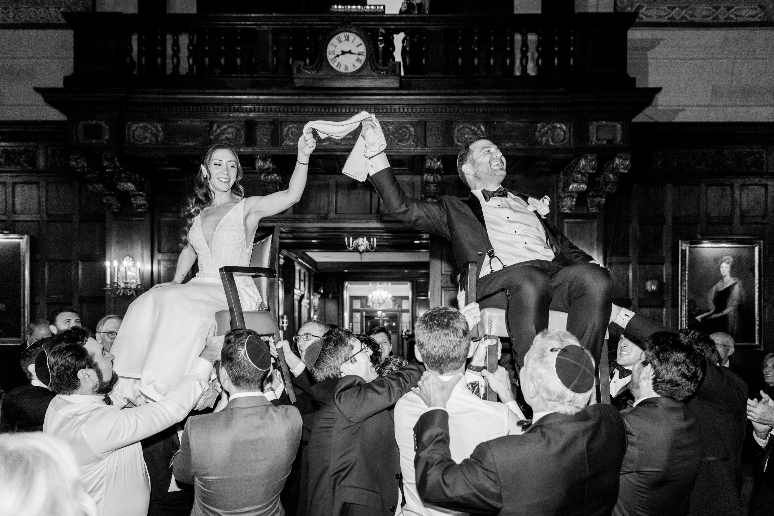 Couple dance hora at the Harvard Club of Boston Wedding