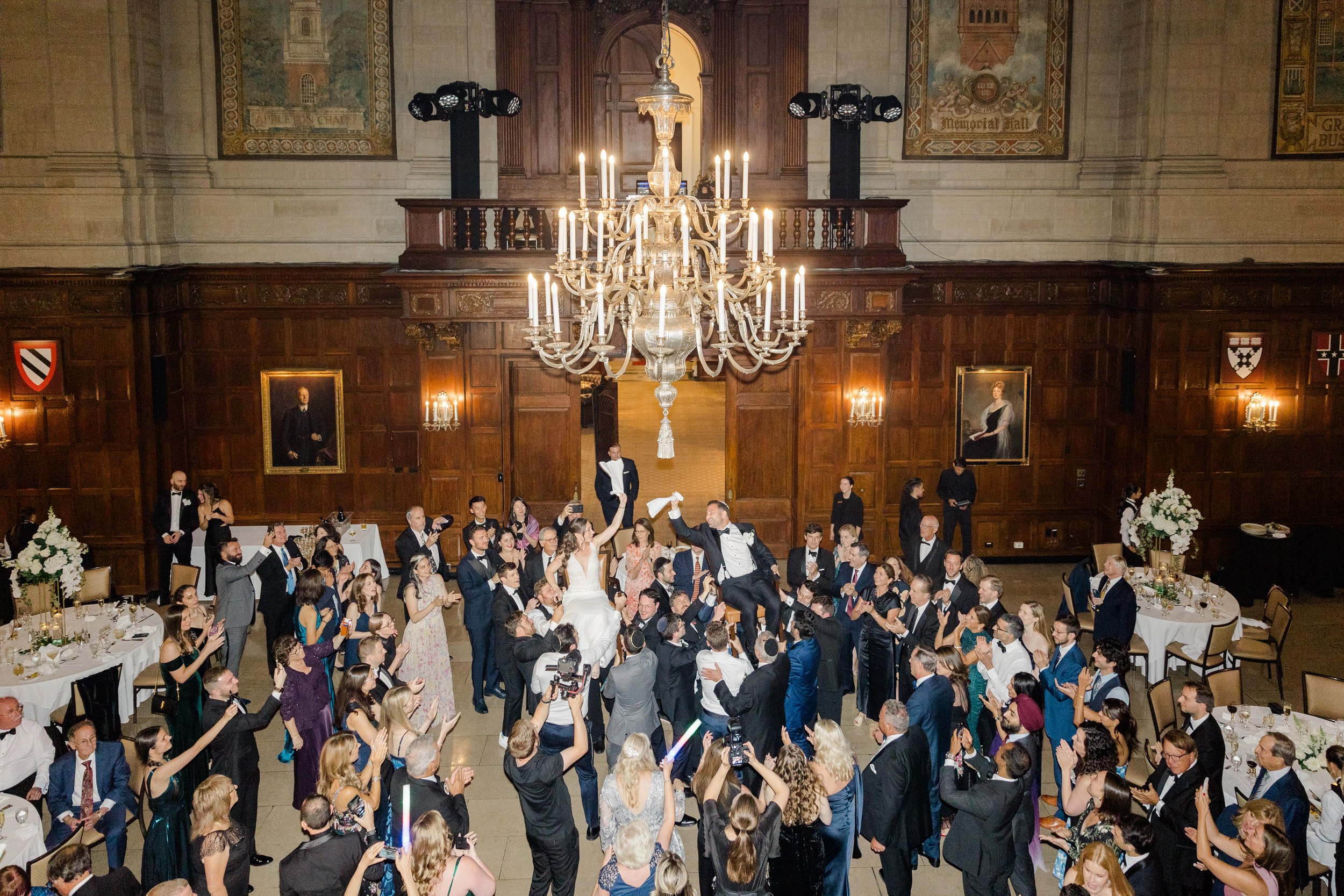 Couple dance hora at the Harvard Club of Boston Wedding