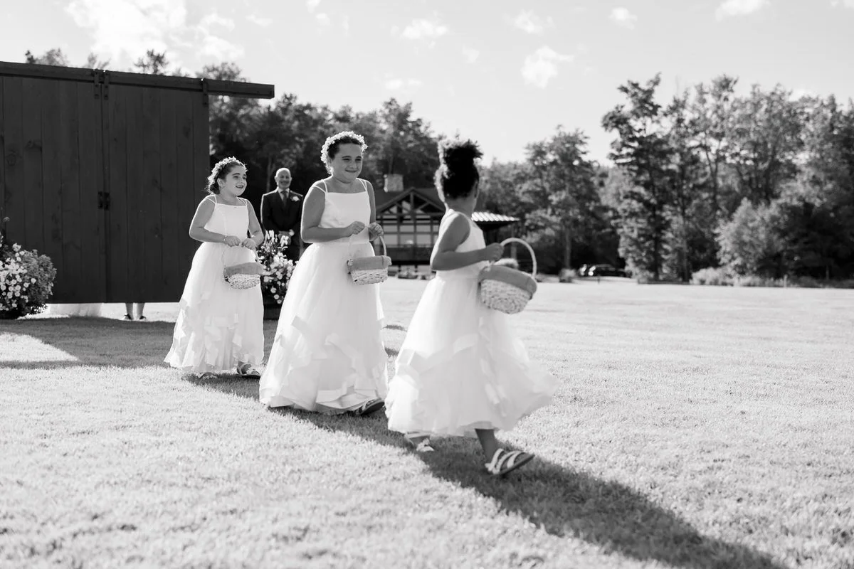 Flower girls walk down aisle at Mountain Top Inn Vermont Wedding
