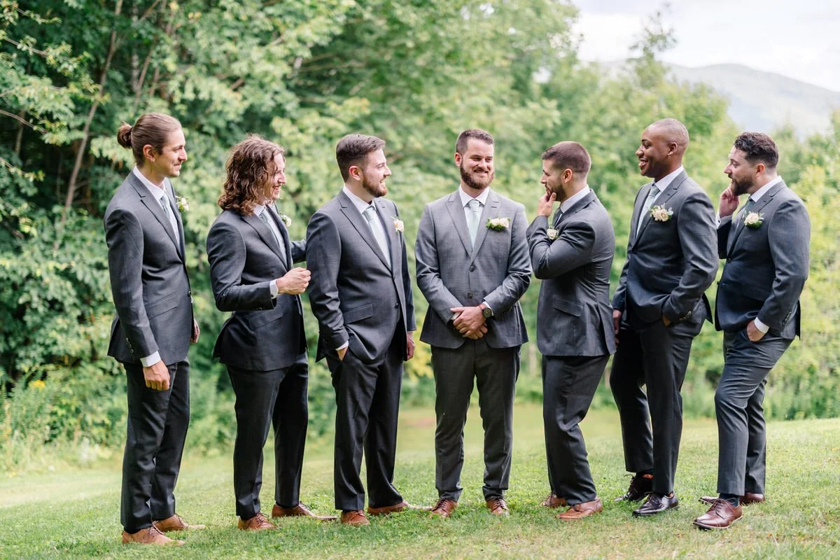 Groom and groomsmen laugh as they wait for their wedding at Mountain Top Inn Vermont Wedding