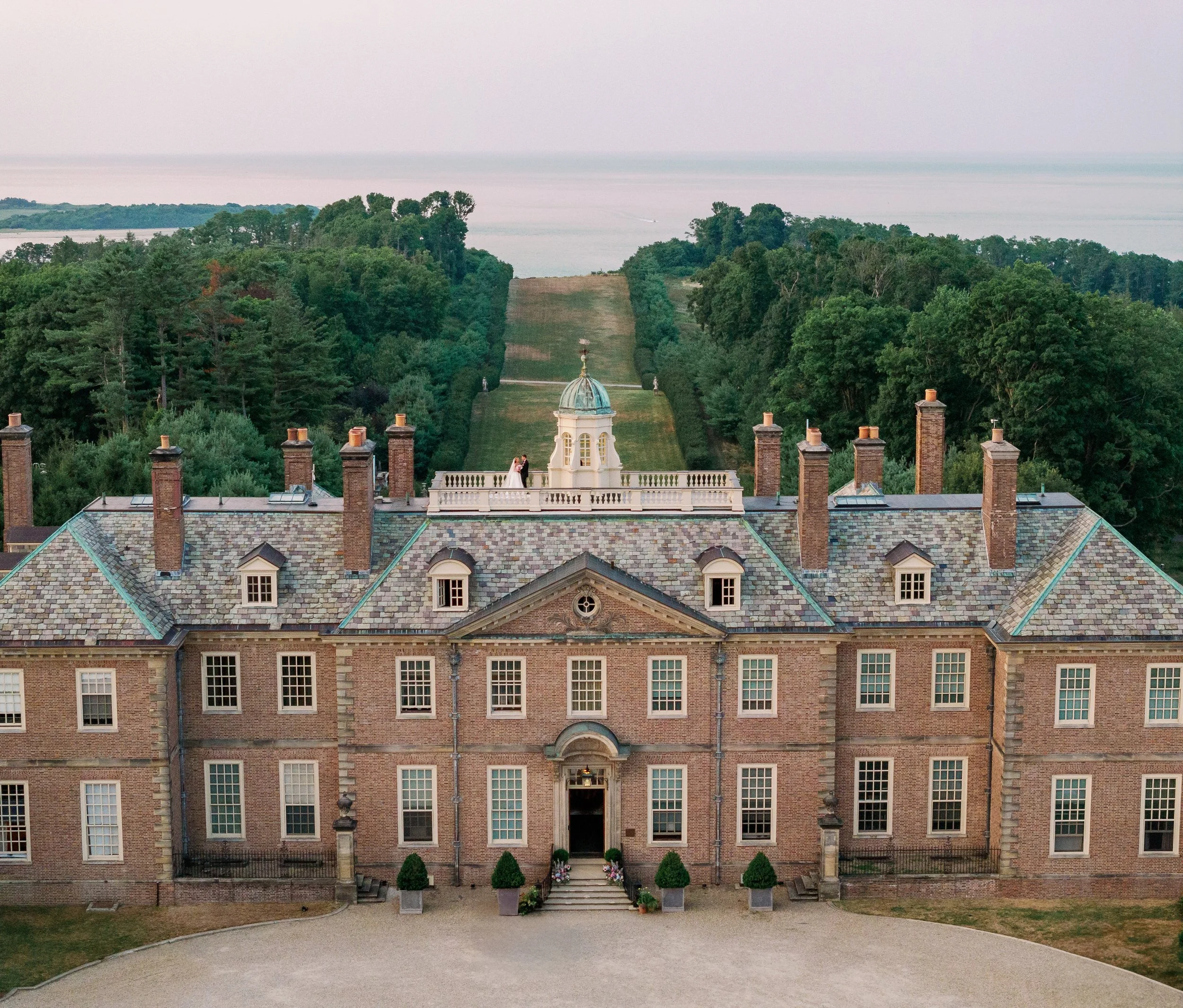 Wedding couple drone photo at the Crane Estate during golden hour