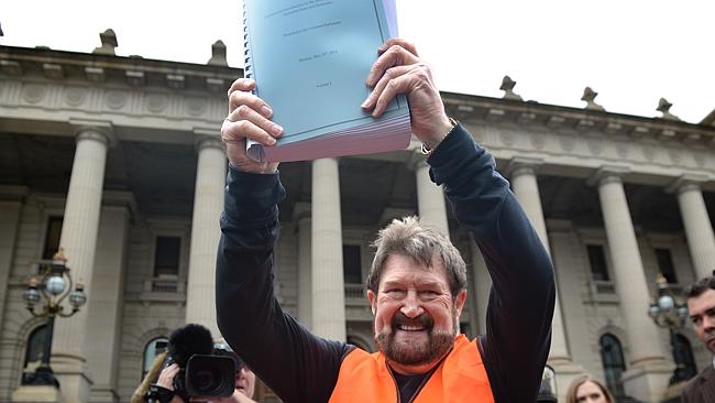 Derryn Hinch waves the petition in front of Parliament House. Picture source: Tony Gough