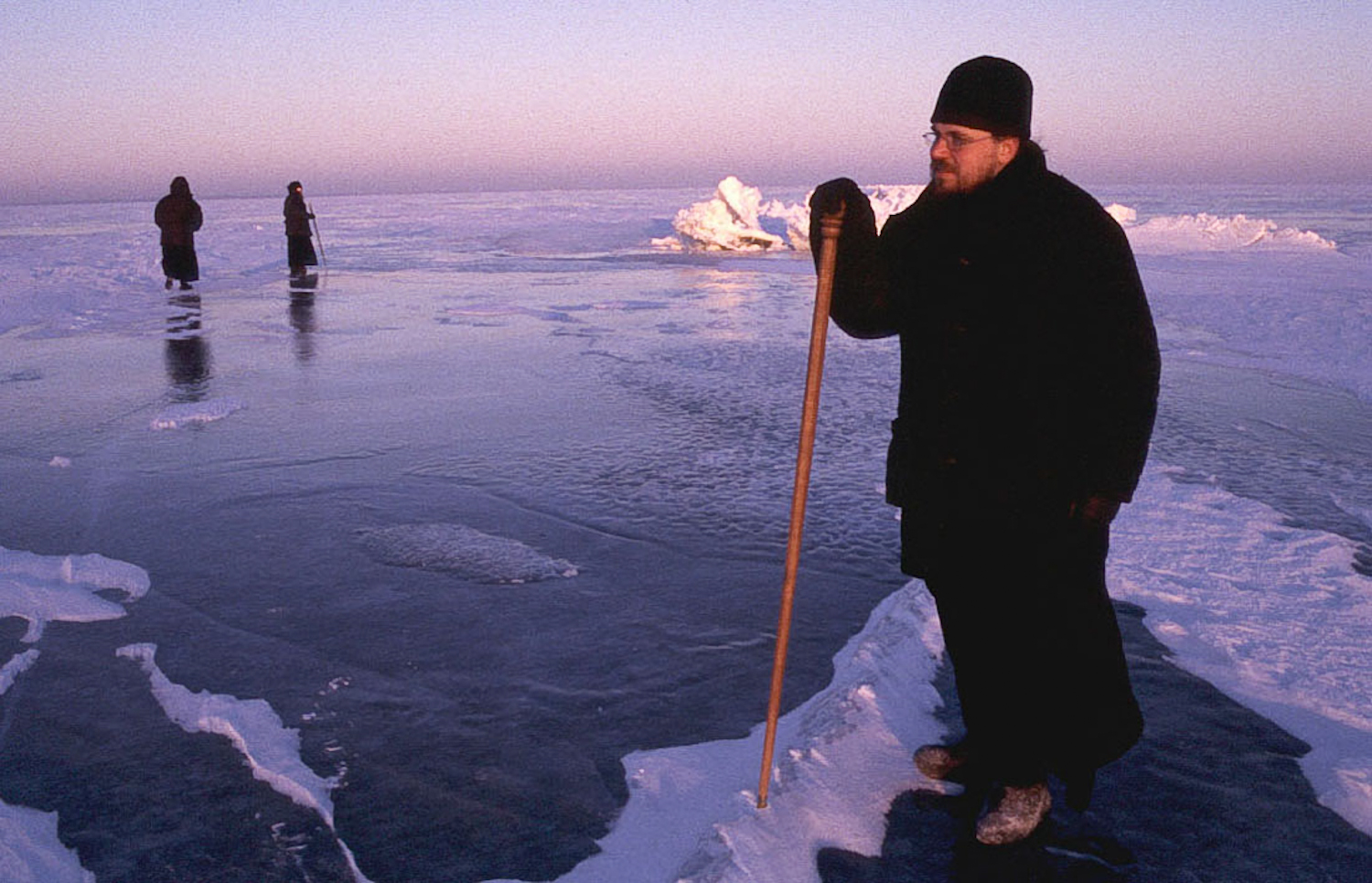 Father Boris testing the thickness of the ice on Lake Ladoga before driving from the island to the mainland to pick up supplies.