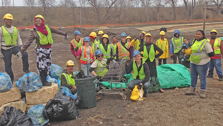 YO crew members with trash picked up at the Trout Brook Nature Sanctuary construction site.