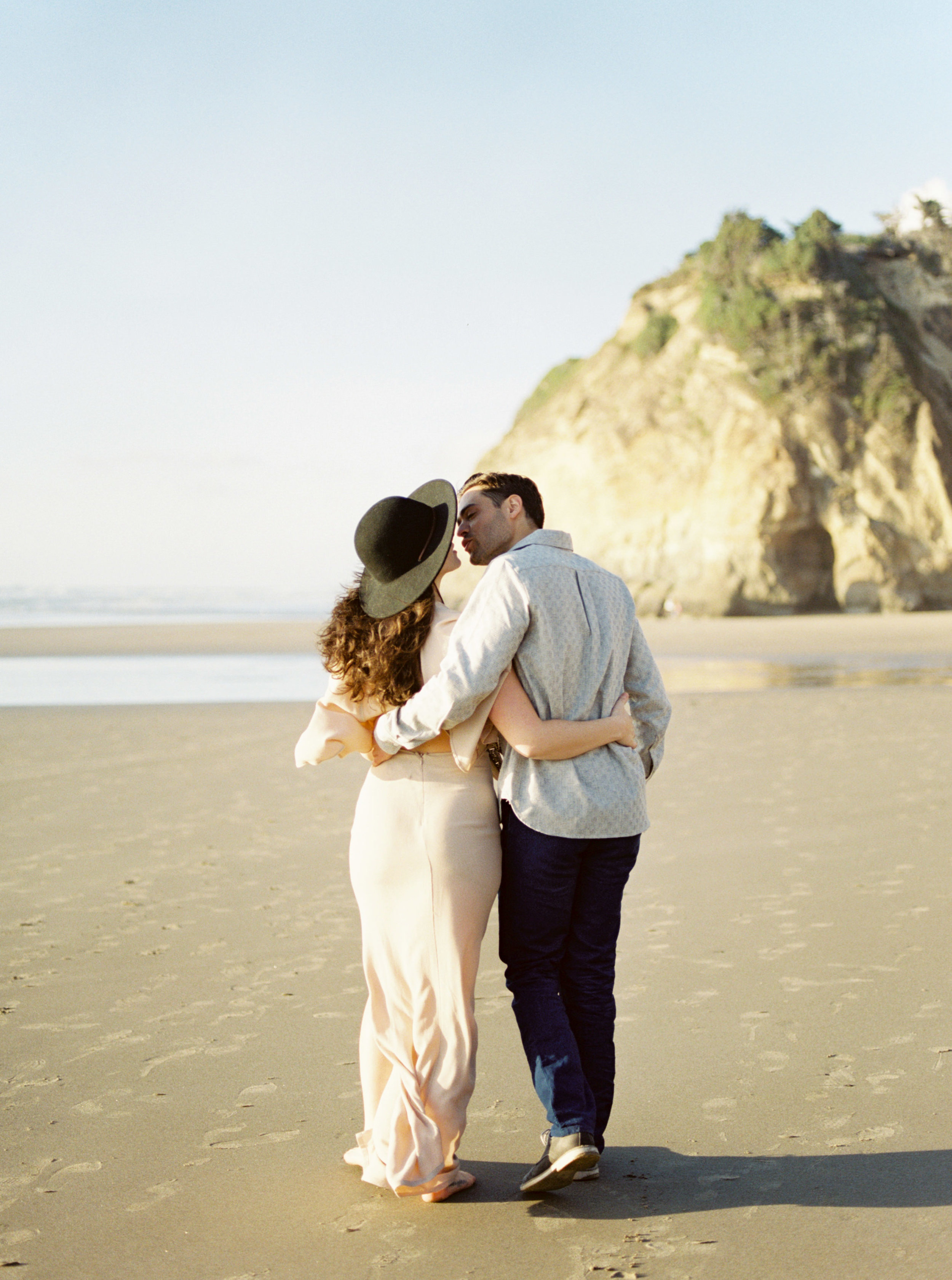 Oregon Couple Kissing on Beach During Engagement Photos