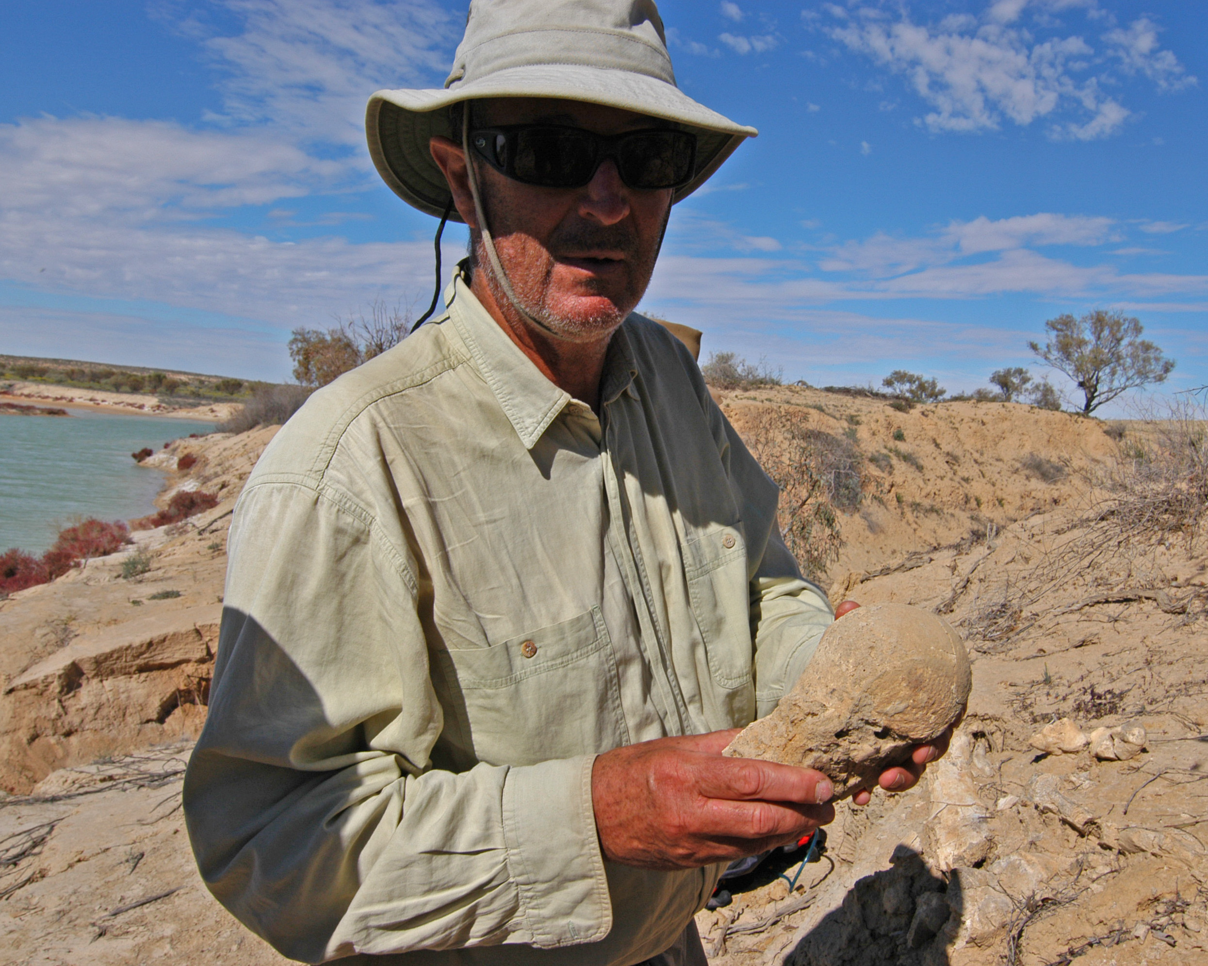 The expedition doctor examines a fossilised megafauna bone.
