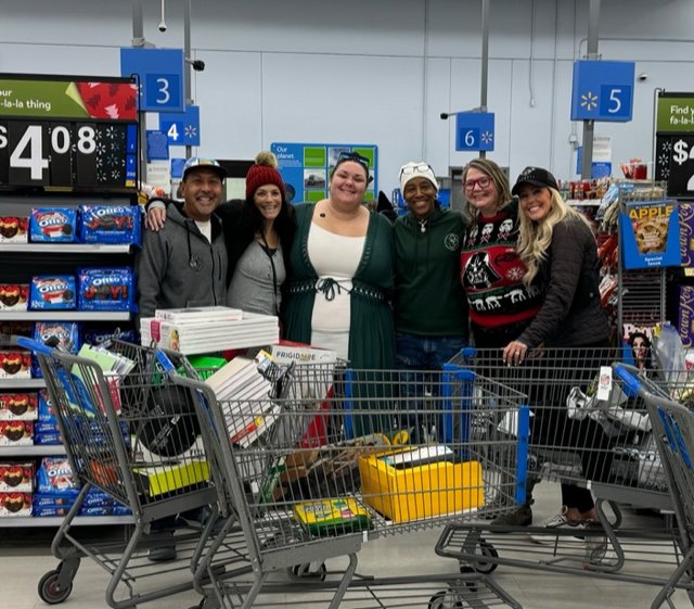 Greenacres Staff filling their shopping carts to get ready for Christmas Day.jpg