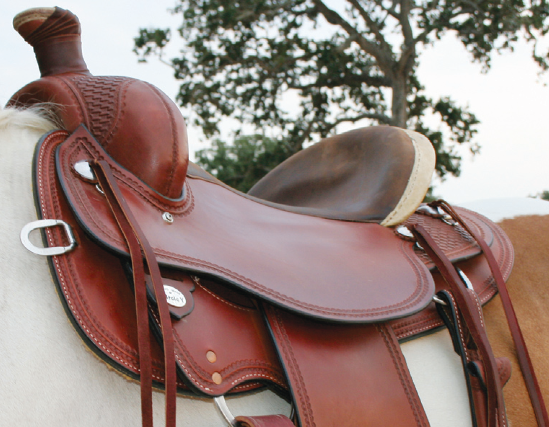 RIGHT: Saddle is too wide with gullet resting on horse’s withers and tilted downward.