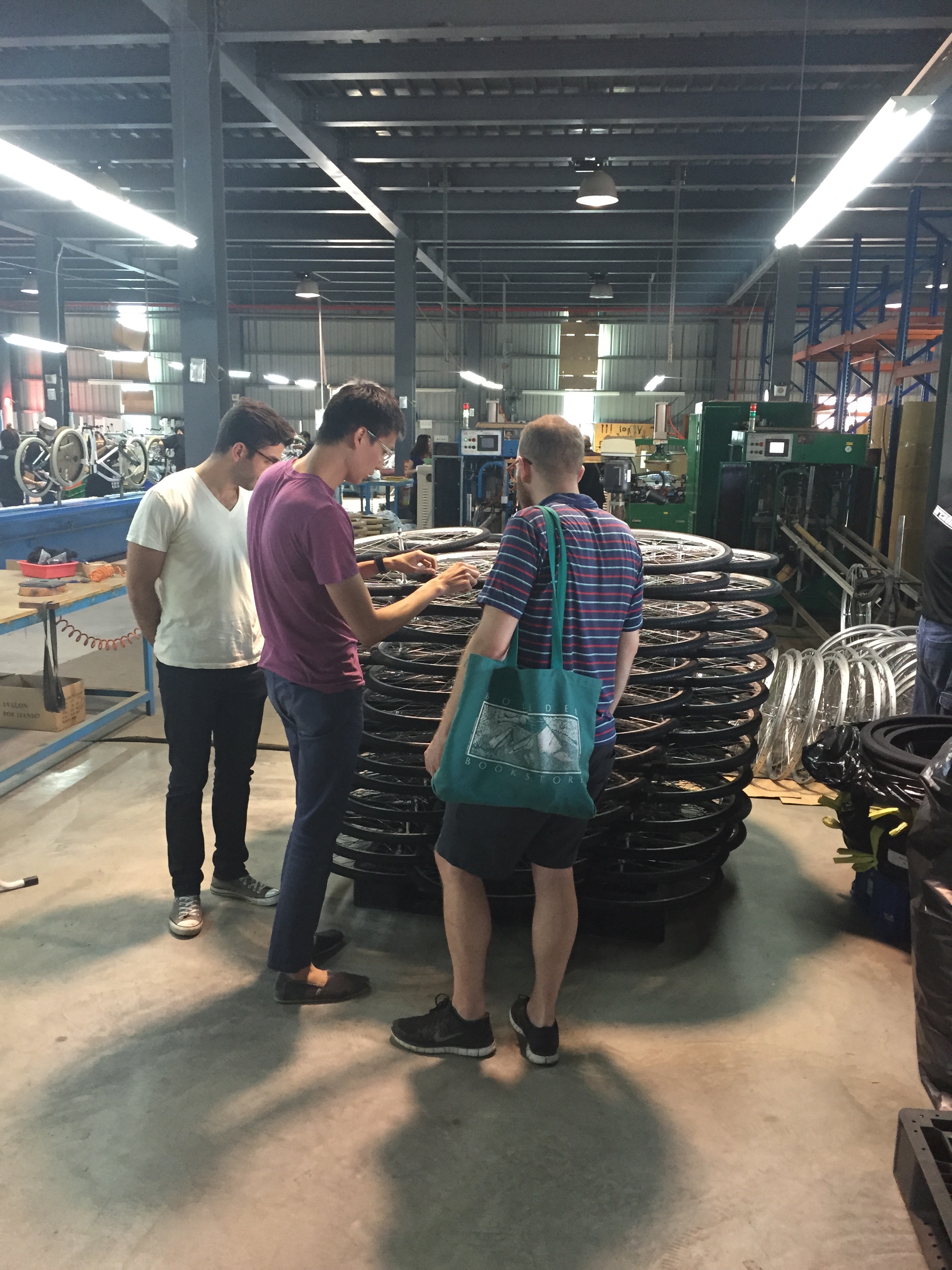 Adam, Kane & Jacob check out a stack of Brilliant's wheels.