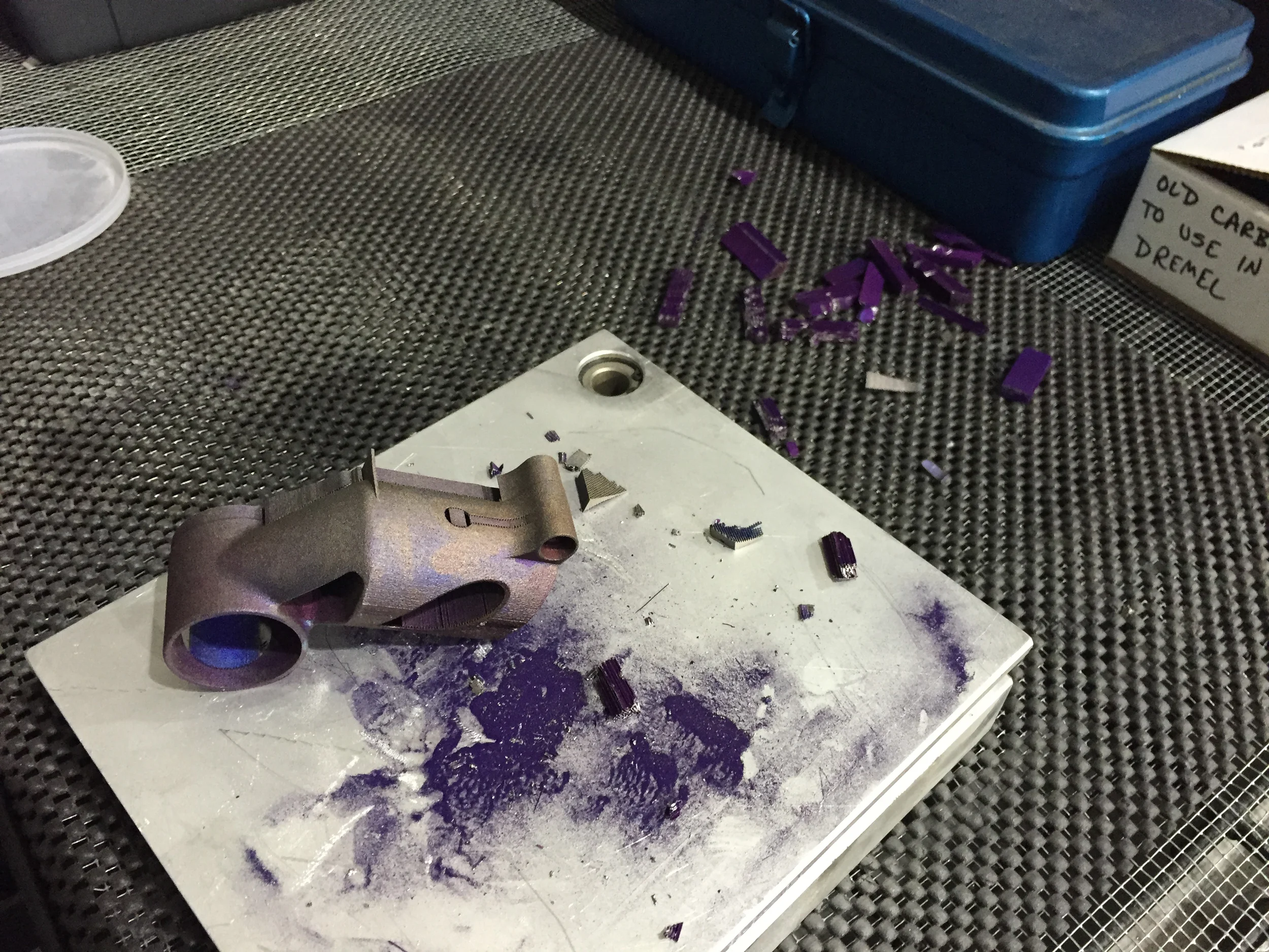 Once the build is complete and the part is wire EDM cut off the plate, support structures are removed manually.