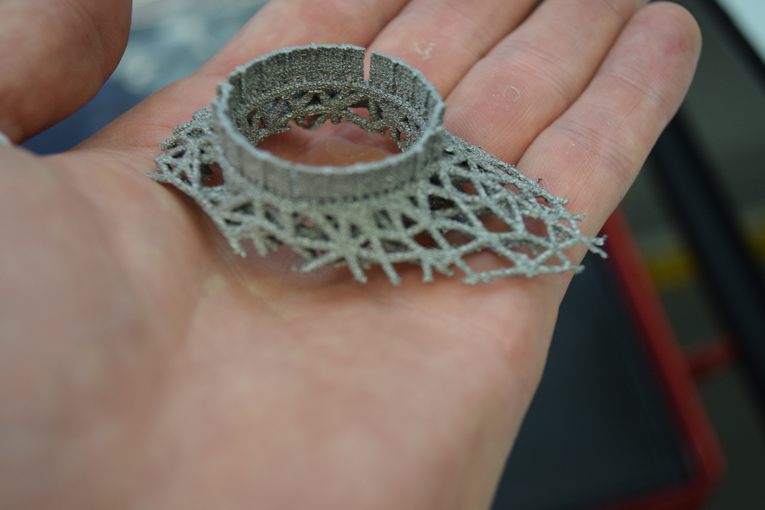 The first 14mm of my latticed bike stem, printed in titanium on an Arcam A2x. The part is upside down (relative to the build orientation) in this photo.