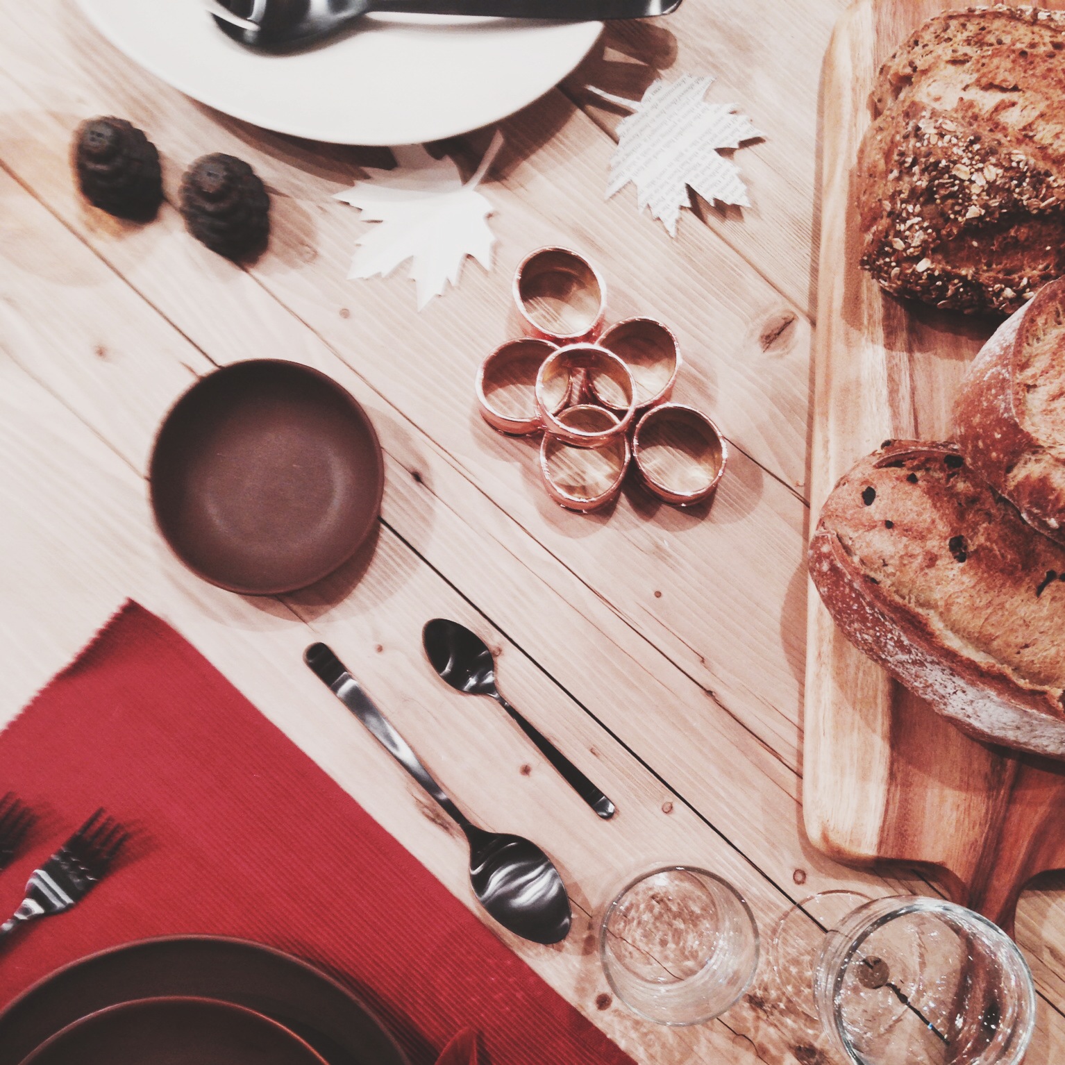 The table setup. I was in love with all the copper elements, and I think the textures here are working well together (between the copper, wood, and fabric, and bread, it feels rustic, as it should.)