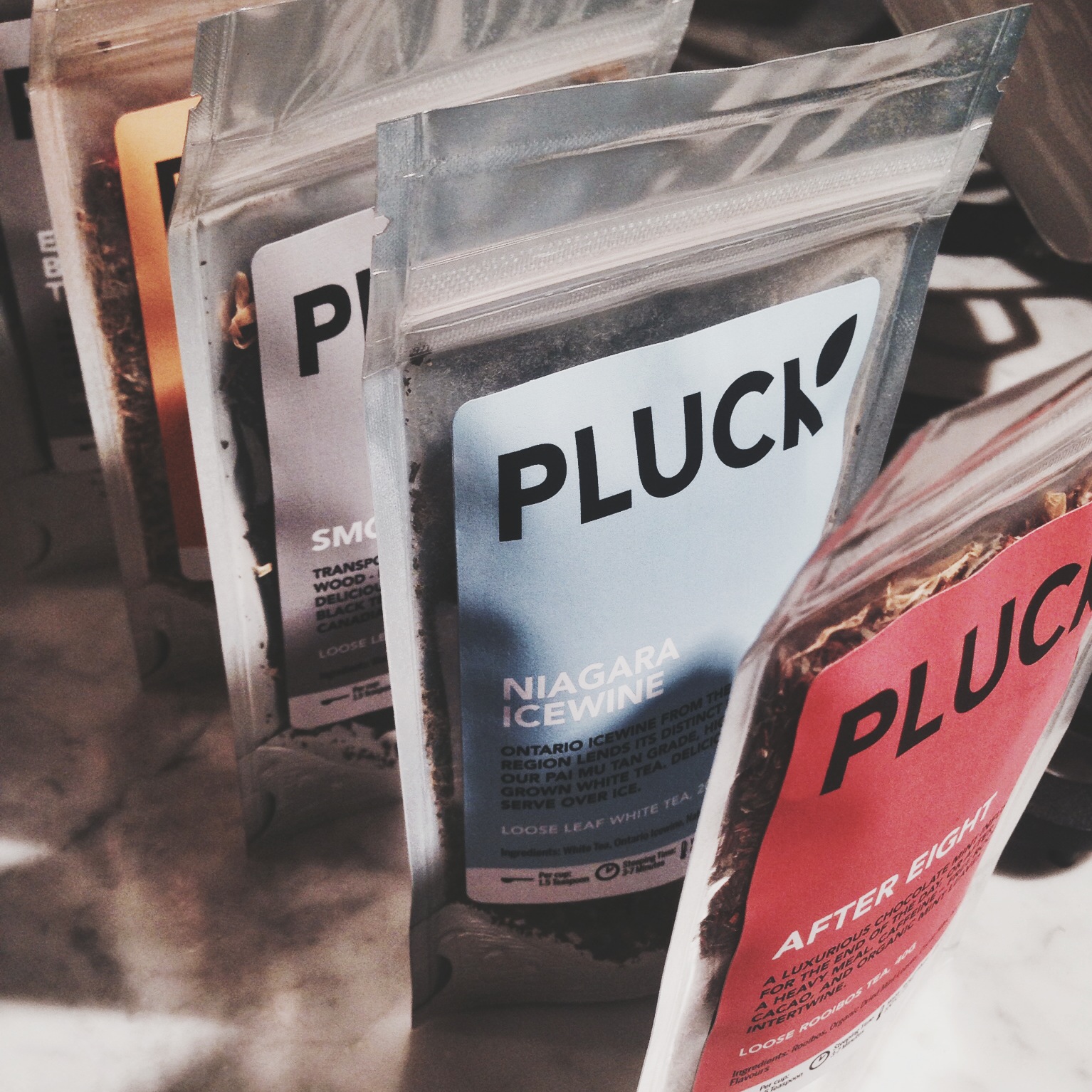 These Pluck teas caught my eye as well. Check out these flavors. Niagara Icewine. Is this a joke? I need this. Right now. The one behind it is "Smoky Maple" which sounds the perfect "windows-open-reading-a-book-fall-time" tea. But seriously... Niagara Icewine. I need this.