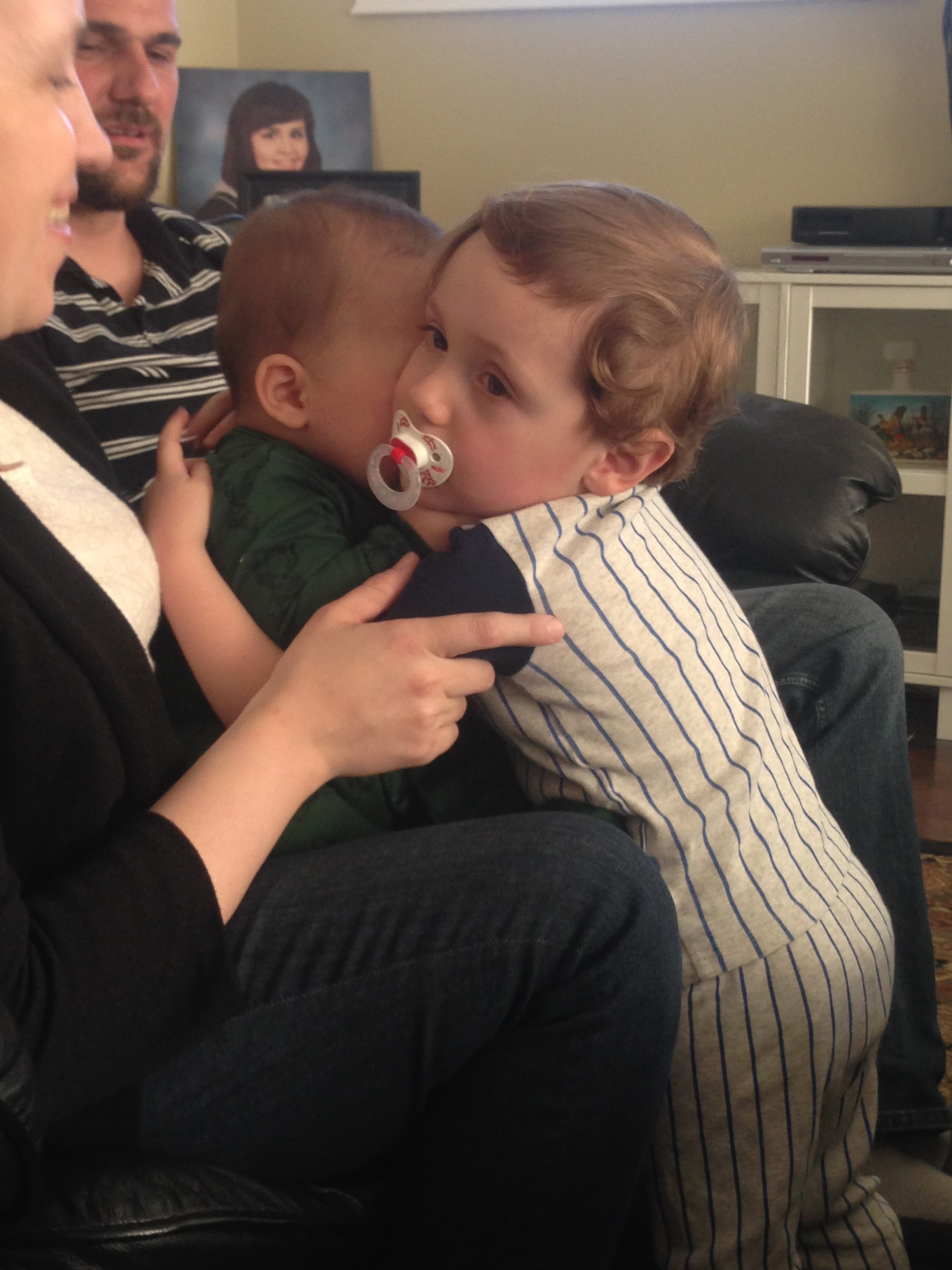 Also look at this pic of my nephew hugging his baby cousin for the first time. B'AWW. Also don't look at the pic of me from graduation in the background, lol. #bangs 