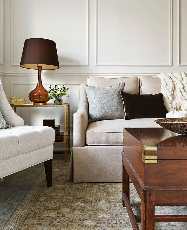 This cozy little corner is one of my favourites. Even though it's more on the traditional side of what we usually do, everything about it speaks to me. It's fairly monochromatic, and the only pattern here is on the rug, which keeps it feeling fresh and current. All the richness comes from the textures and materials, including the panel moulding on the walls - one of my favourite design tricks. I would love to curl up here with a good book!⁠
⁠
Design by @laurasteininteriors⁠
⁠
#laurasteininteriors #luxuryinteriors #luxurydesign #torontodesigner #torontointeriors #torontolife #custominteriors #customdesign #livingspaces #livingroomdesign