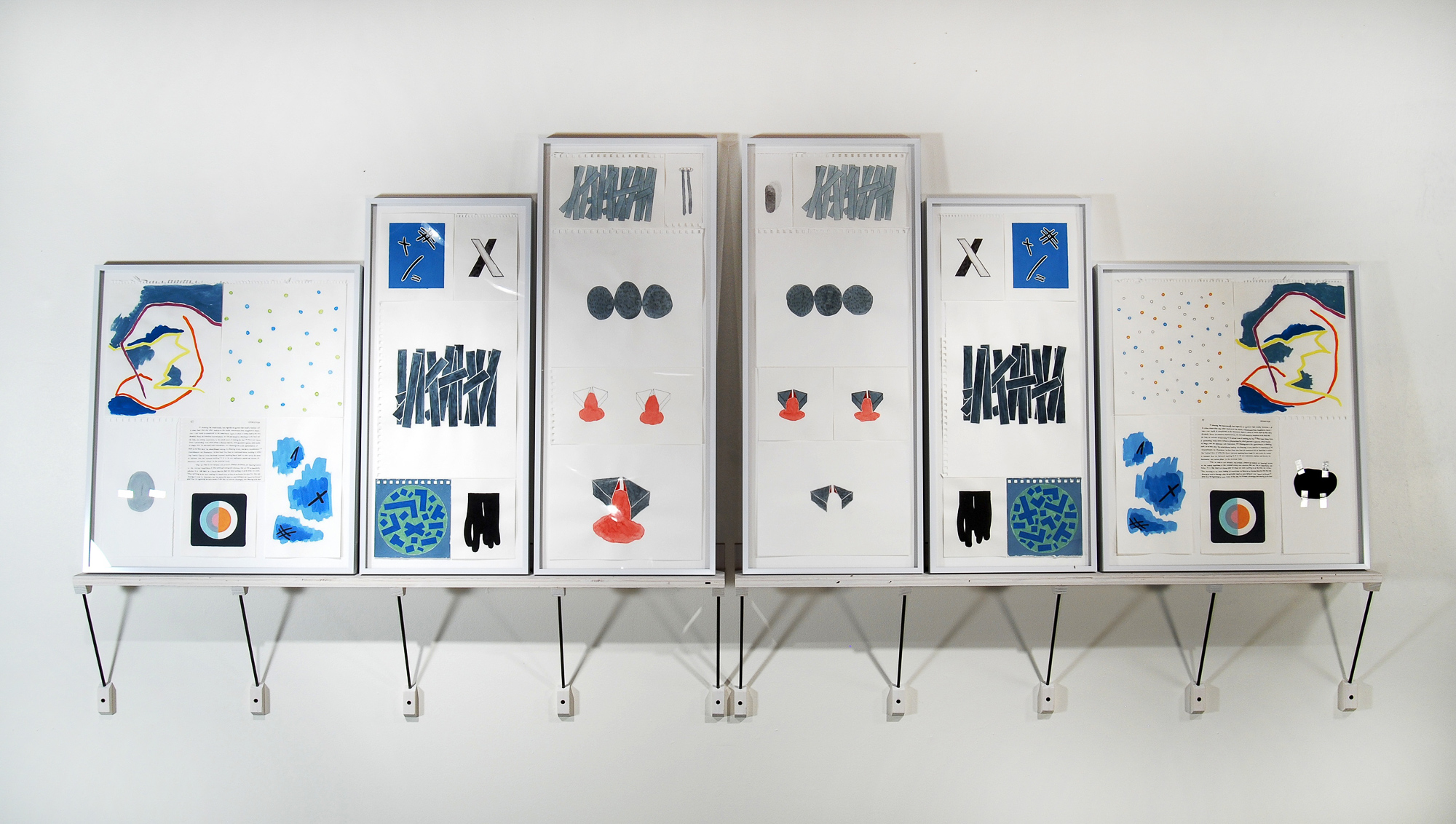 Between One and The Same—Part 4 (left side) | 2011 Raku-fired earthenware, mixed media on paper, frames, dyed plywood, steel supports, misc. fasteners. 103 inches wide.