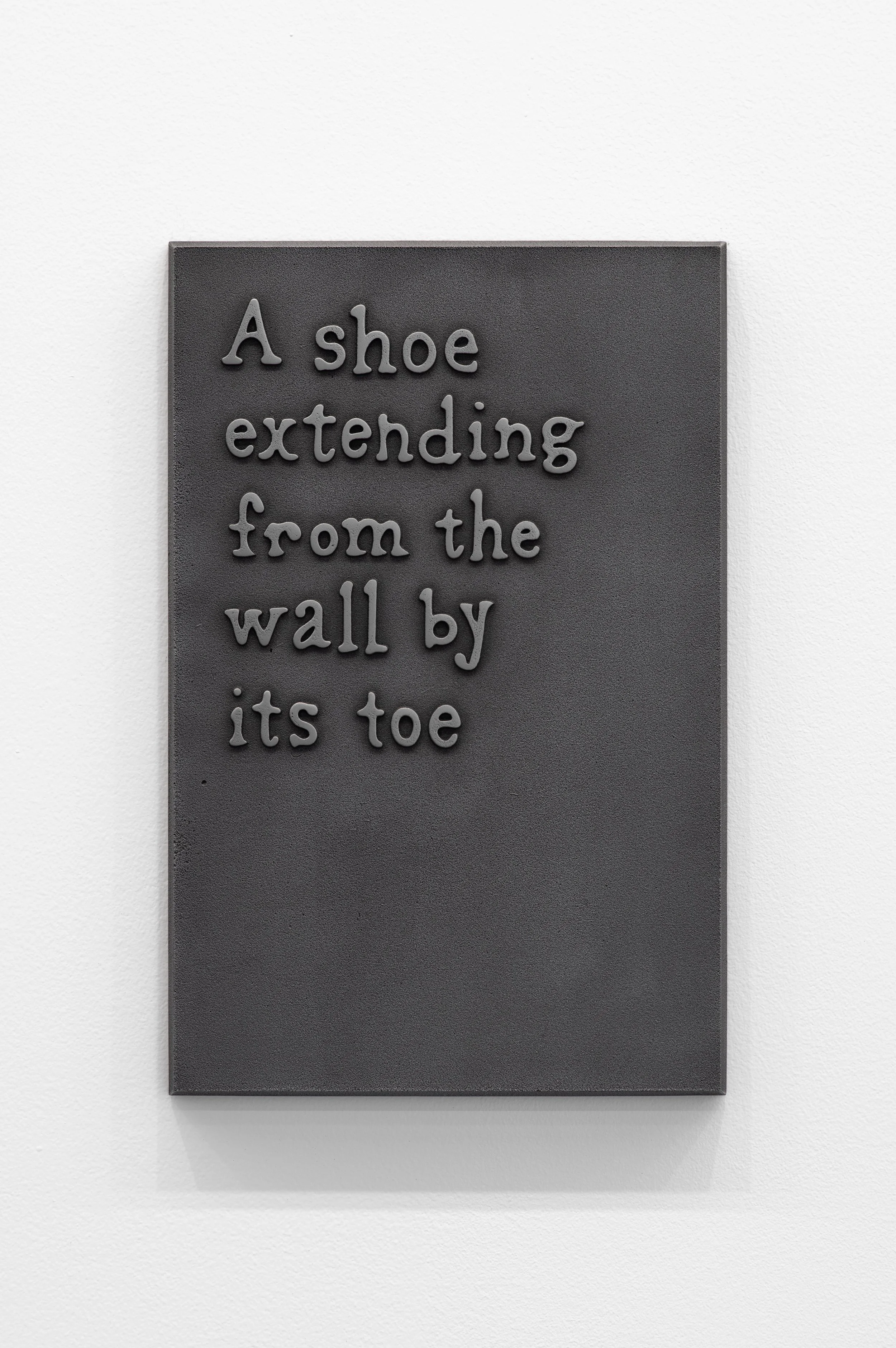 30_A shoe extending from the wall by its toe-1.jpg