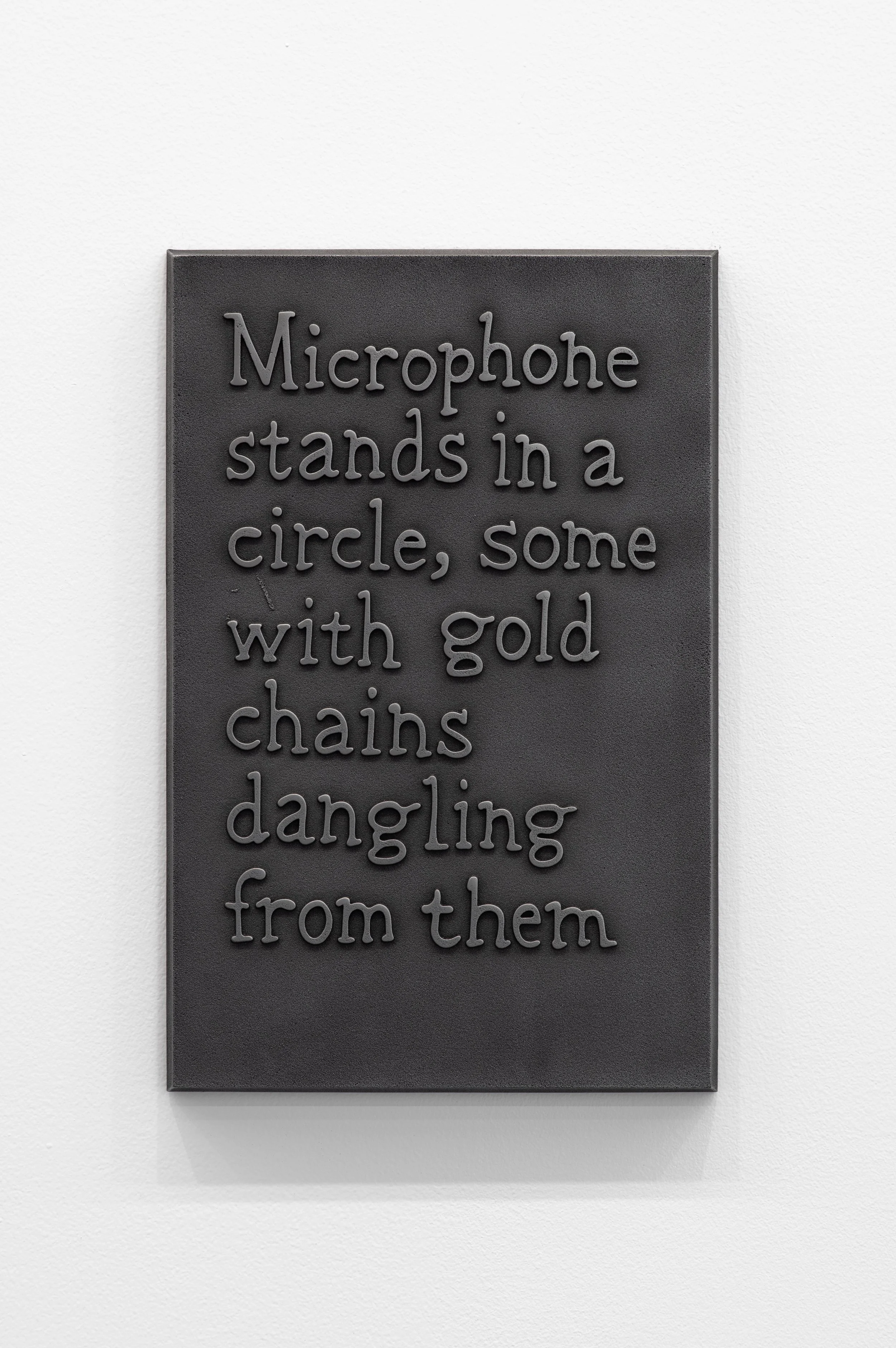 44_Microphone stands in a circle, some with gold chains dangling from them-1.jpg