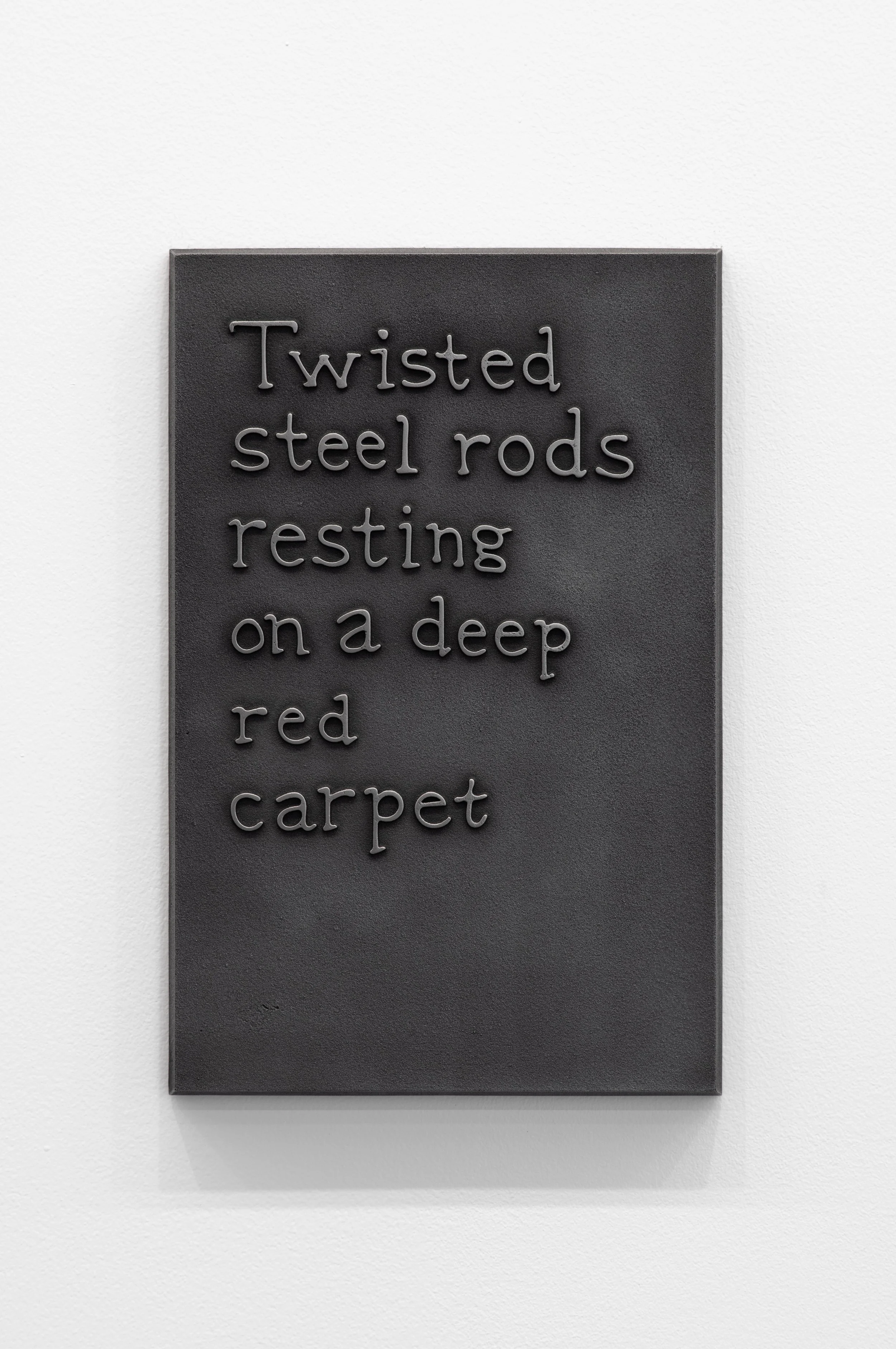 53_Twisted steel rods resting on a deep red carpet-1.jpg
