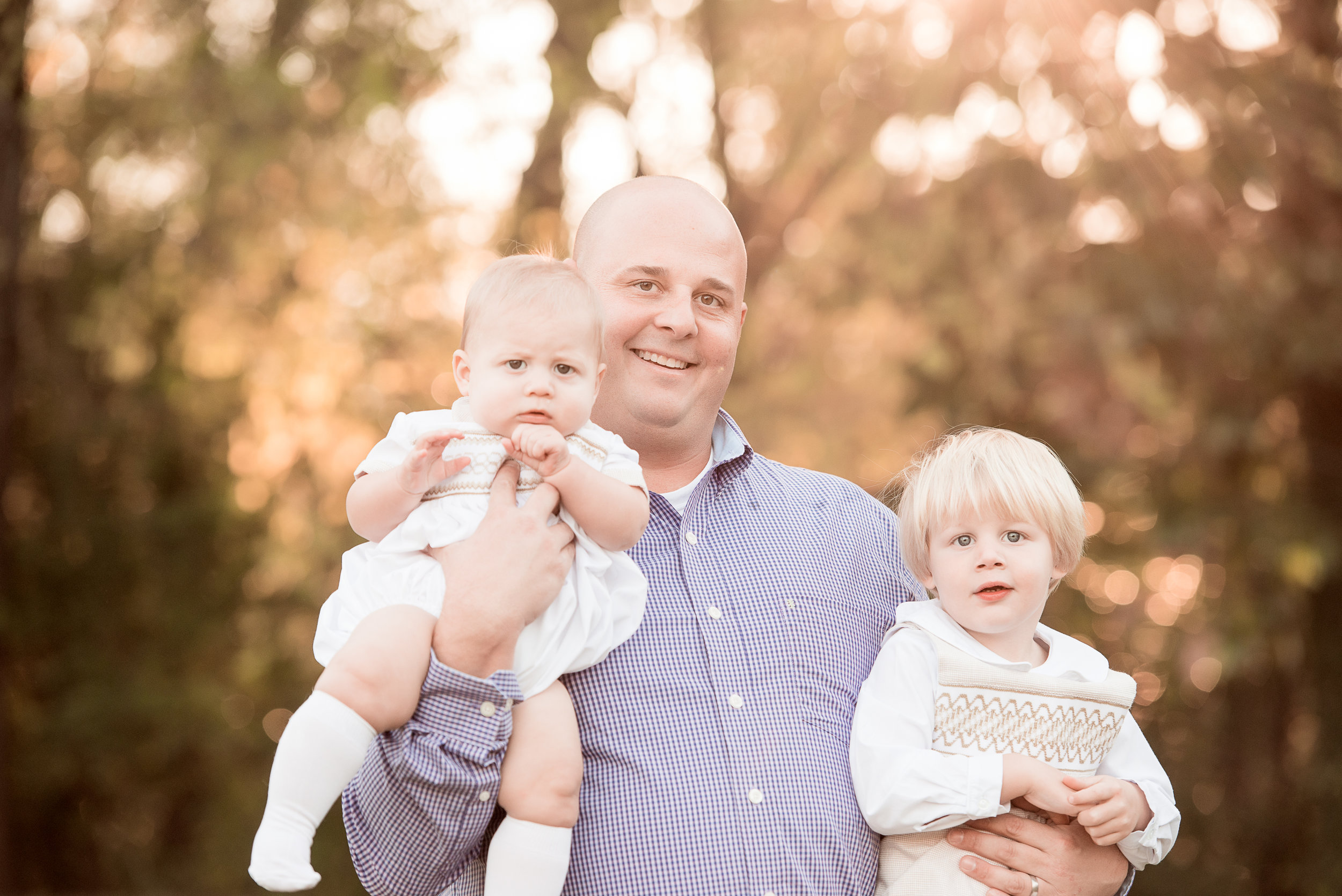 dad and 2 sons in white