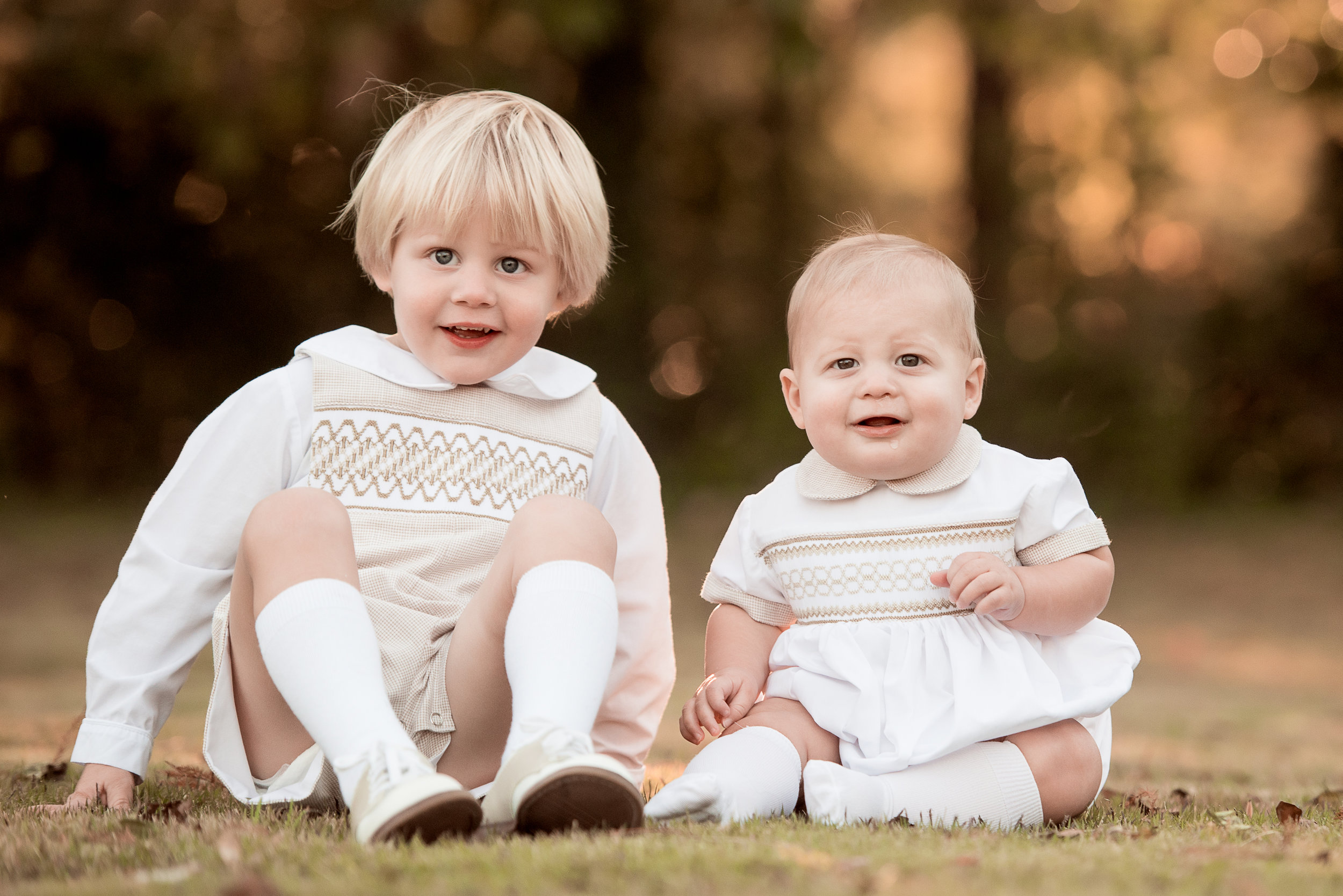 adorable brothers in smocked white outfits