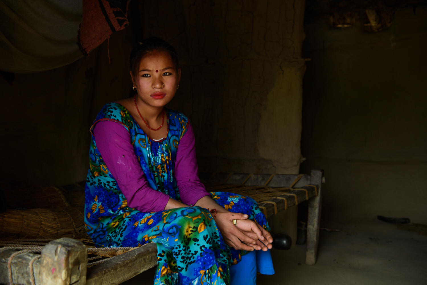  Ganga Maskimagar (17) at her home in Majhi Shivir, Chaumala, Kailali, Nepal. Ganga had an arranged marriage and is five months pregnant. Her husband works as a cook in a restaurant in Delhi. 